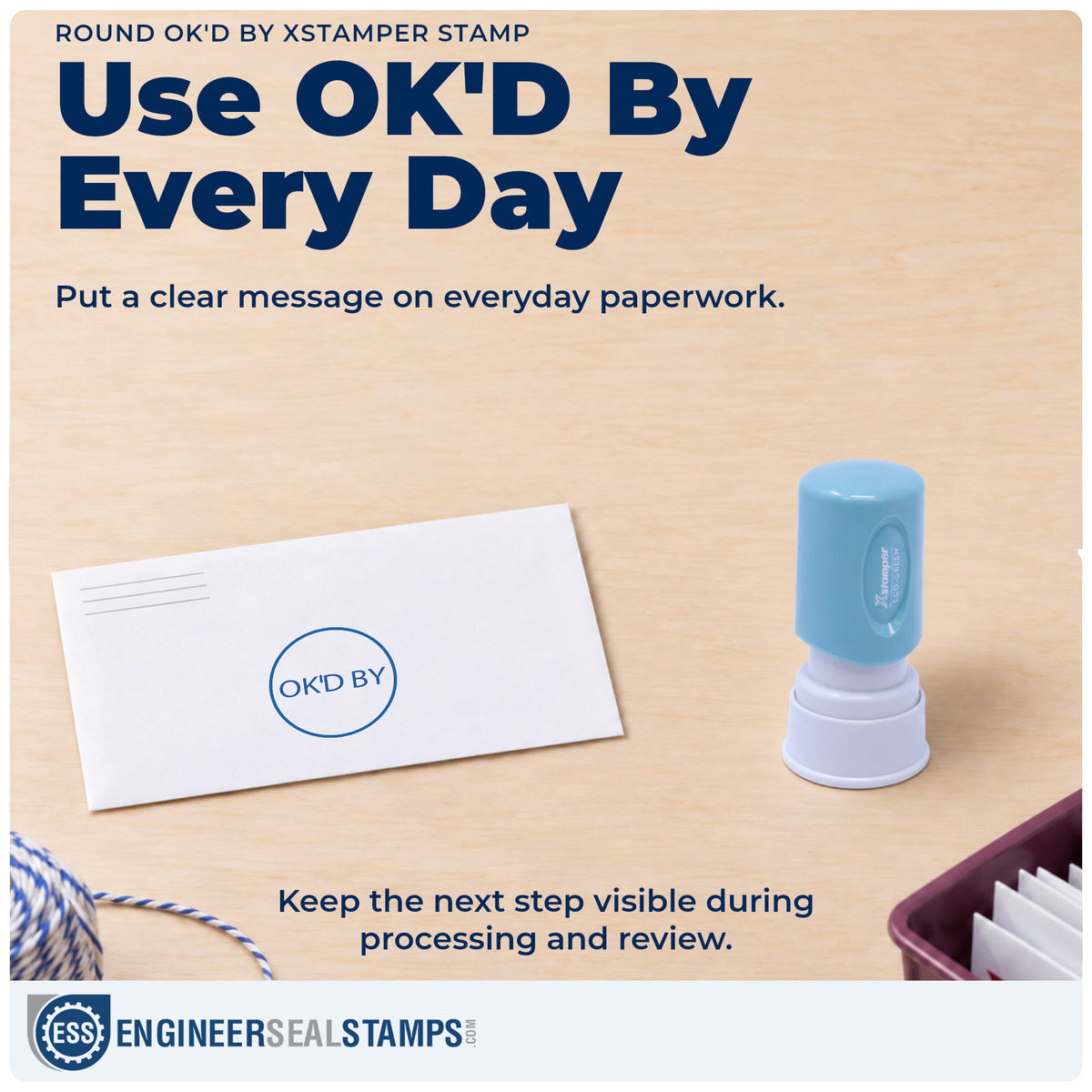"OK'd by" stamp being pressed onto a document during everyday filing