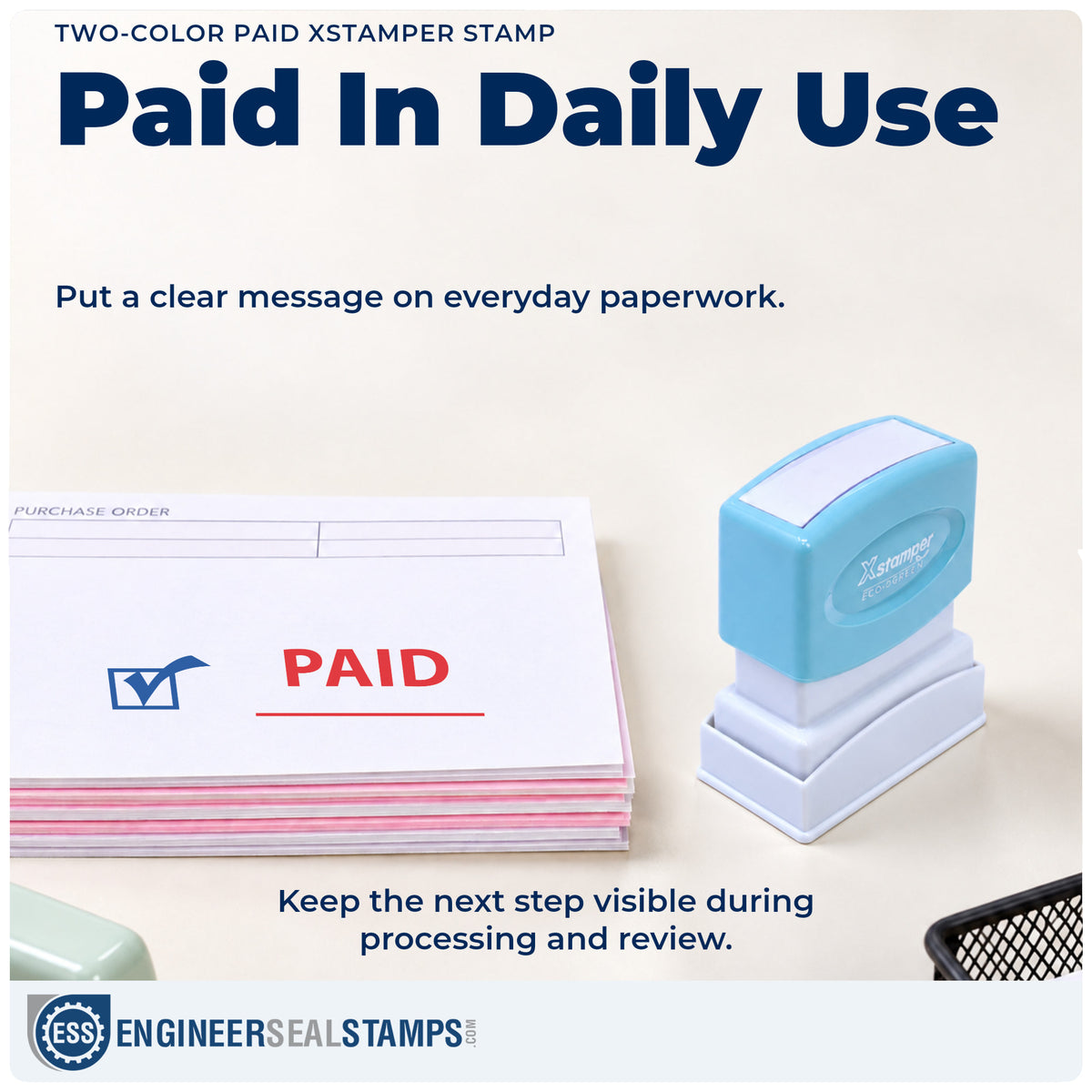 "Paid" stamp being pressed onto a document during everyday filing