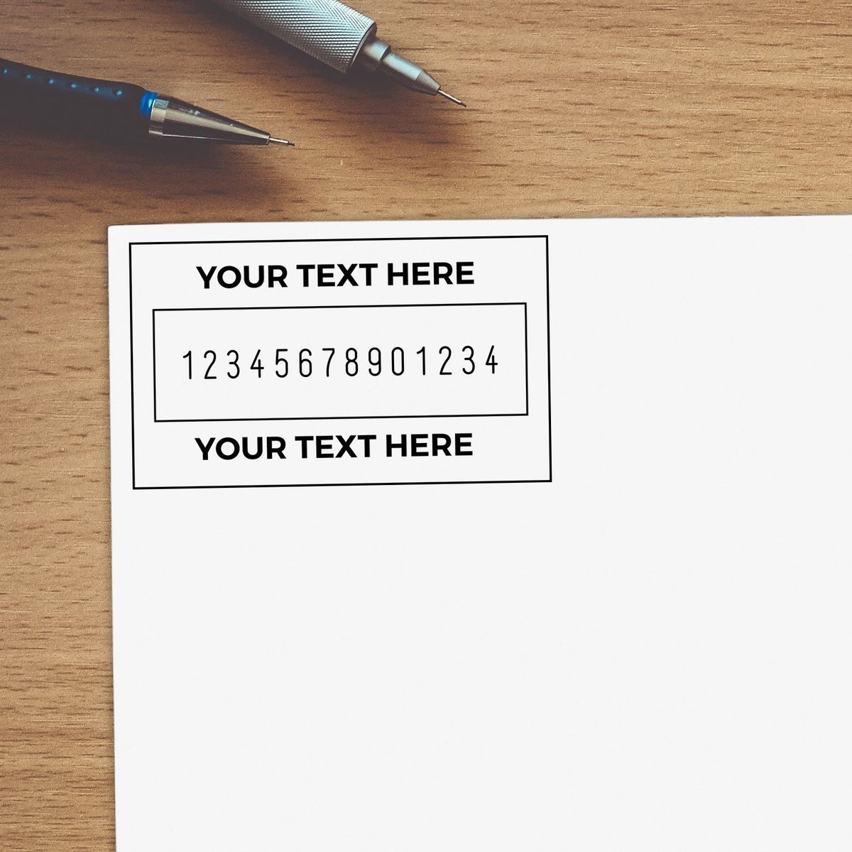 Custom black stamp and seal design on white paper, with text placeholders and numbers on a wooden desk beside two pens.