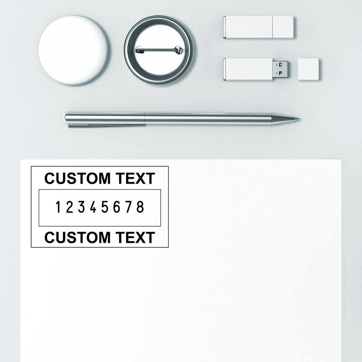 White and silver custom stamp and seal set with round seal, metal pen, USB drive, and sample custom text layout.