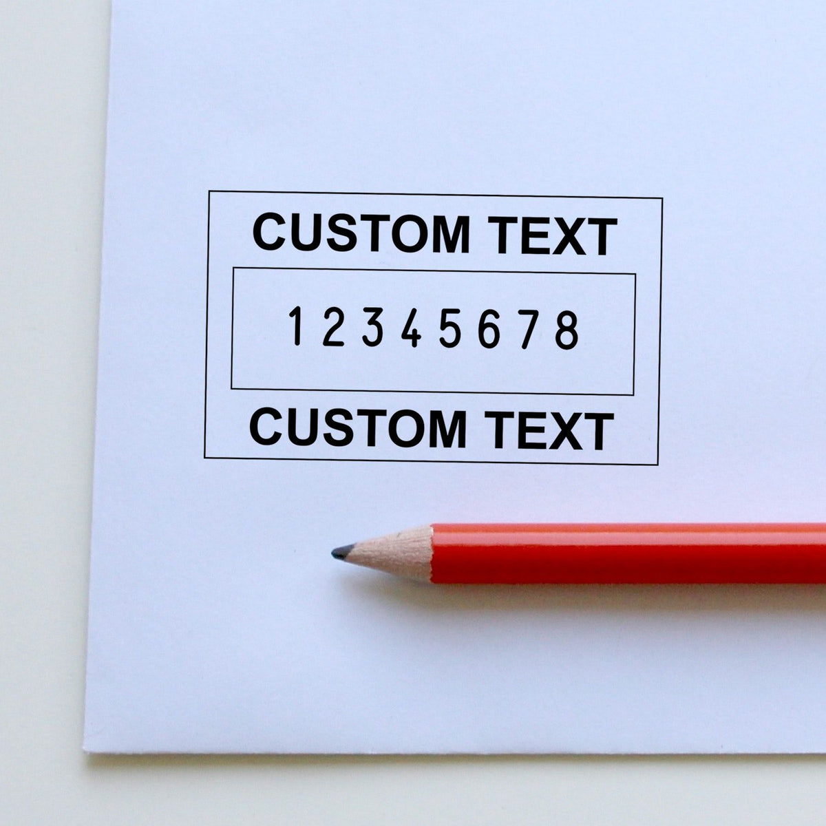 Custom stamp and seal template on white paper, black outlined box, numbered 12345678, with red pencil