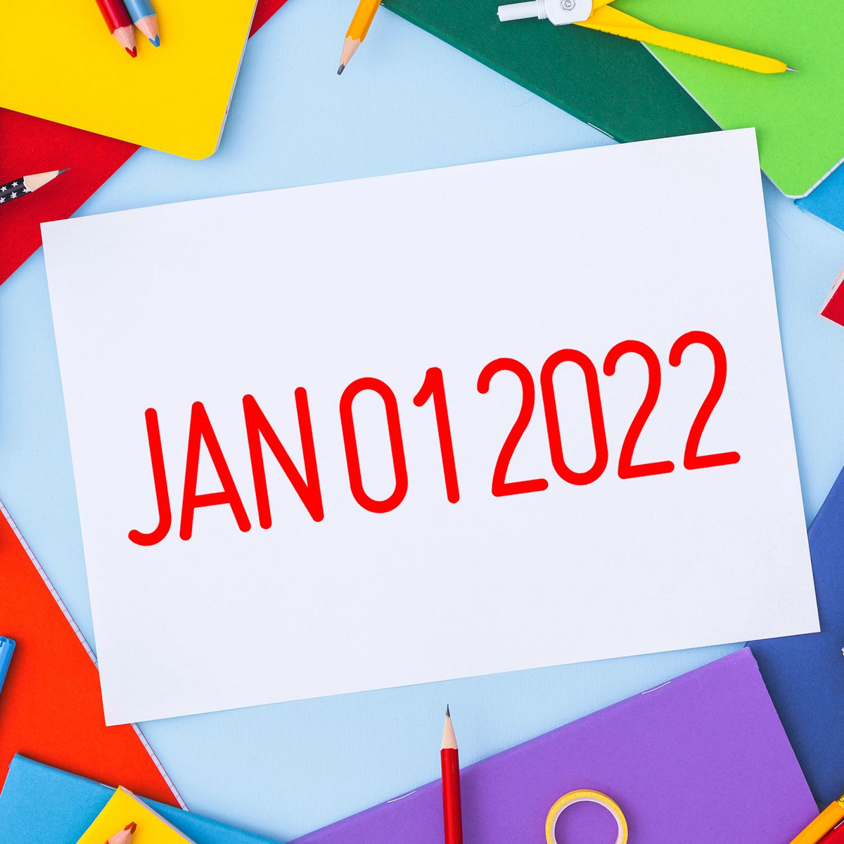 Red JAN012022 date stamp on white paper, surrounded by colorful stationery and seal tools.