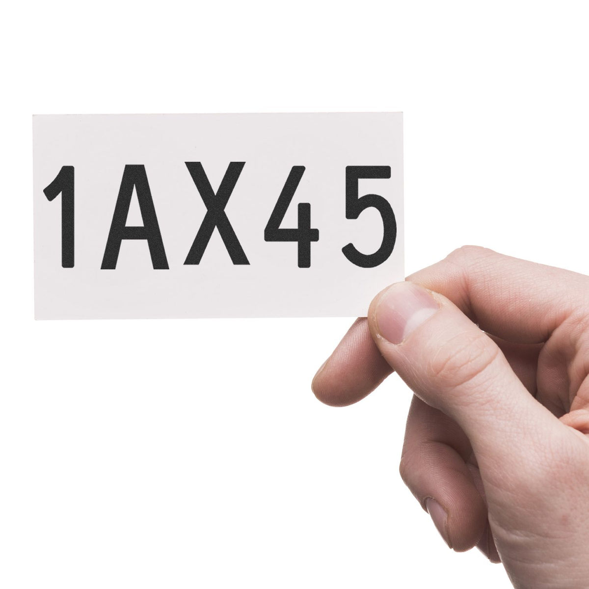Hand holding white stamp and seal card with bold black 1AX45 text on a clean white background.