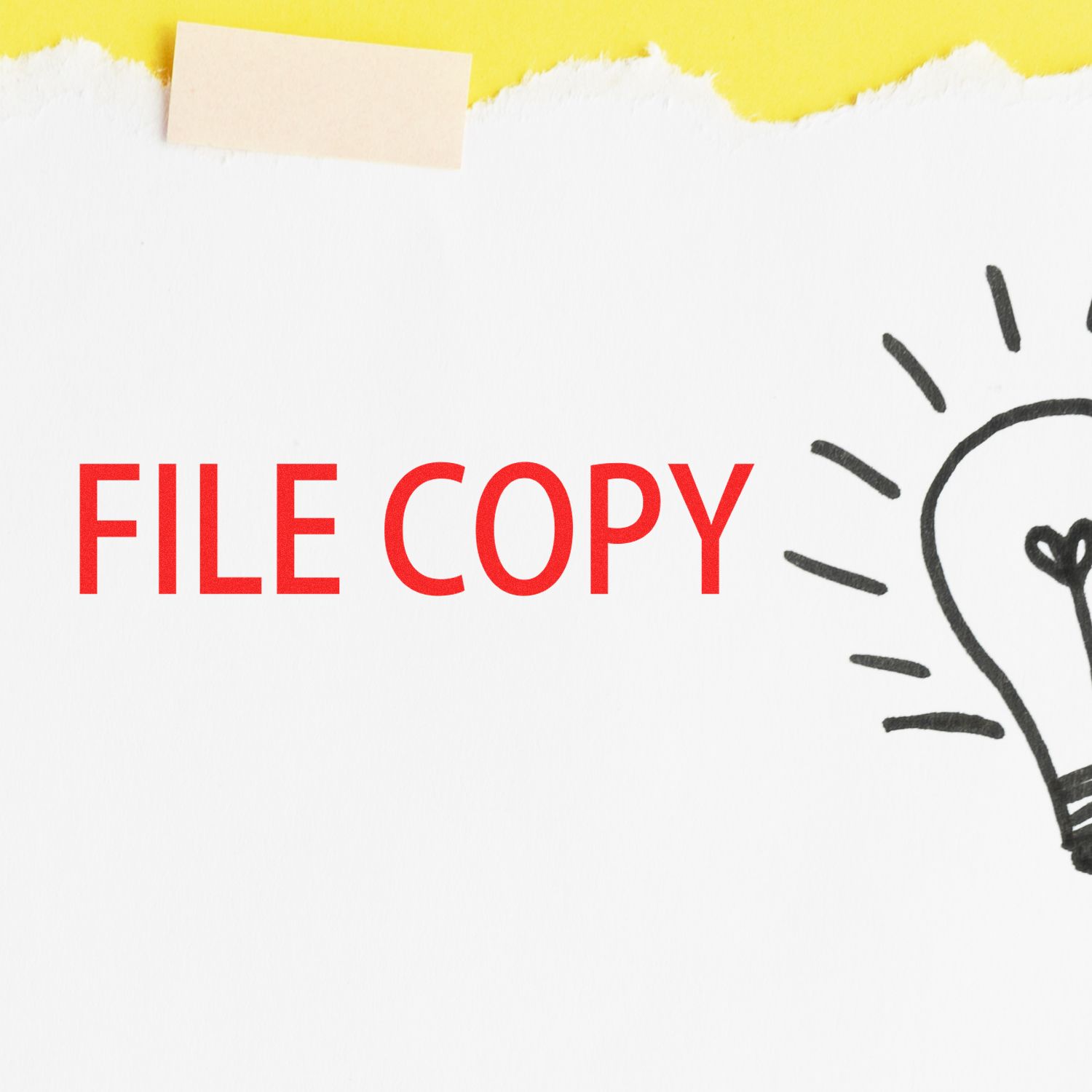 Large Pre-Inked File Copy Stamp imprint in red on white paper with a lightbulb illustration, against a yellow background.