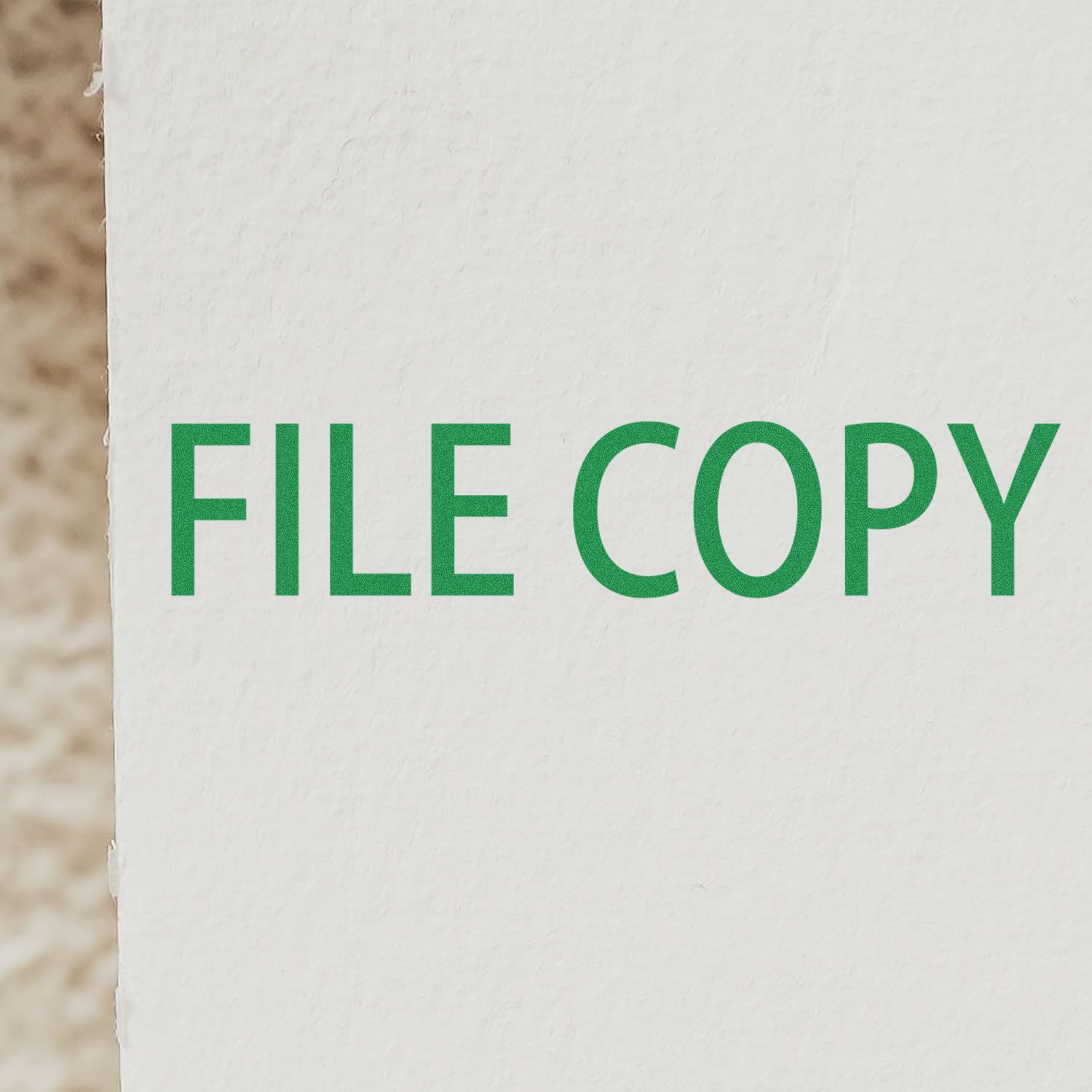 Image of a Large Pre-Inked File Copy Stamp imprinting the words FILE COPY in green on a white surface.