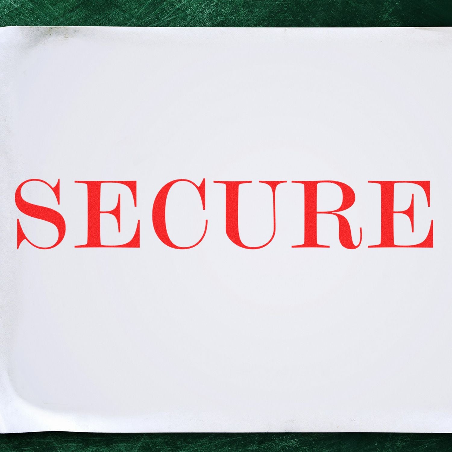 Large Pre-Inked Secure Stamp with bold red SECURE text on a white background, placed on a green surface.