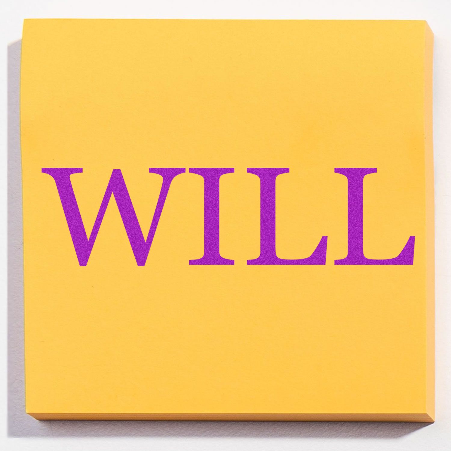 Yellow sticky note stamped with WILL in purple ink using the Large Pre-Inked Will Stamp.