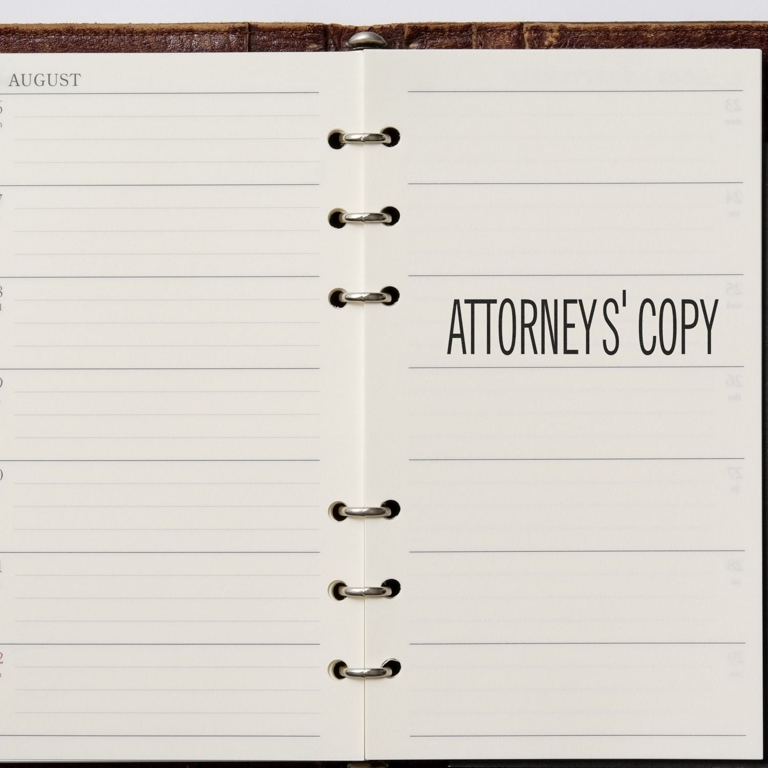 Open planner with ATTORNEYS' COPY stamped on the right page using the Large Pre-Inked Attorney's Copy Stamp.