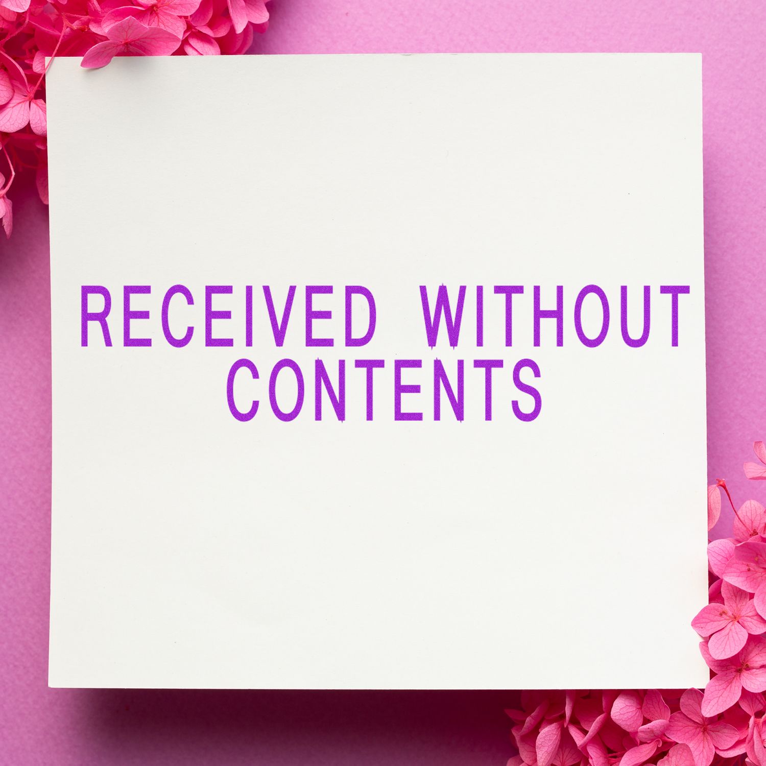 Large Pre-Inked Received Without Contents Stamp on white paper with pink flowers on a pink background.