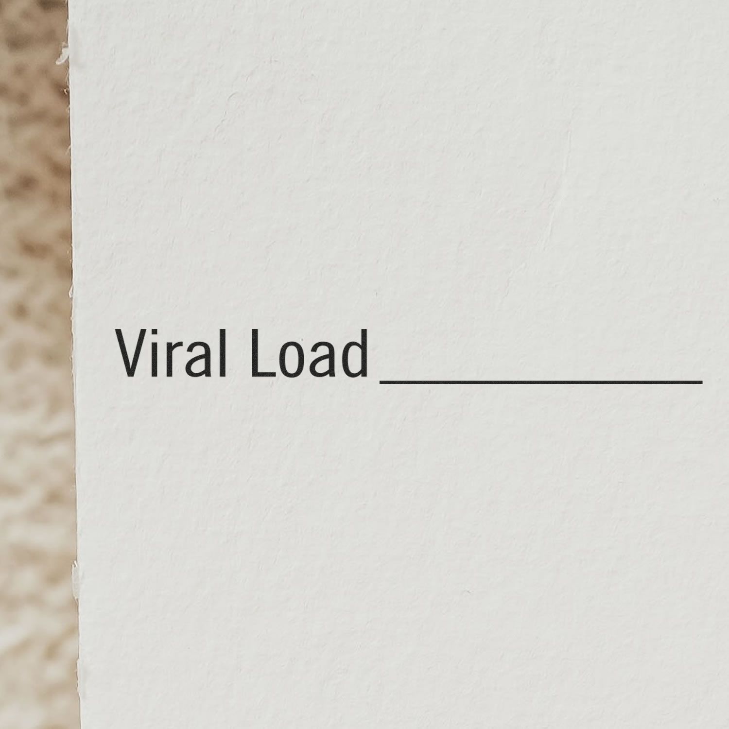 Image of the Large Self Inking Viral Load Stamp showing the text 'Viral Load' with a blank line for filling in information.