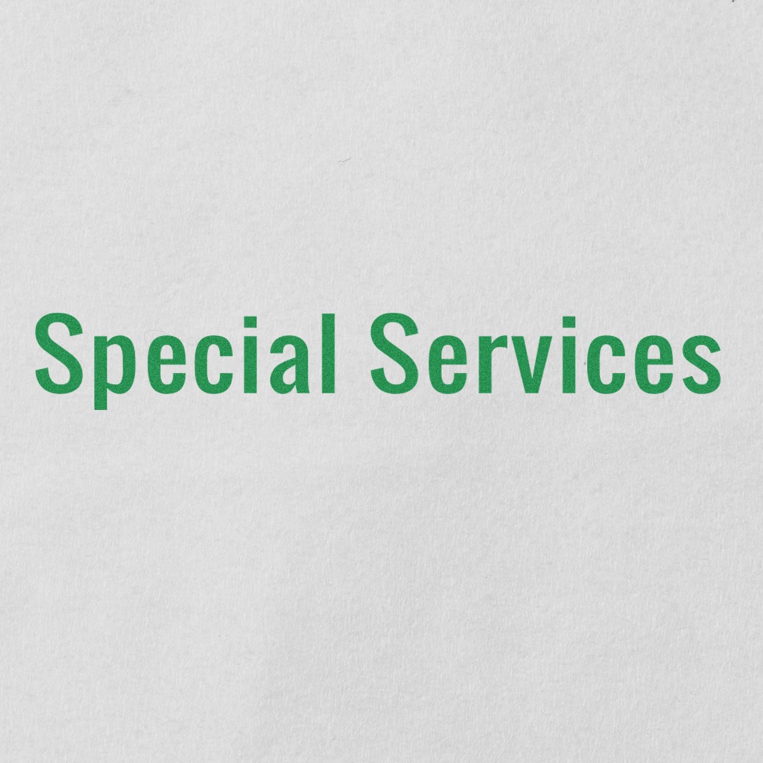 Image of a Large Pre-Inked Special Services Stamp imprint with green text reading Special Services on a white background.