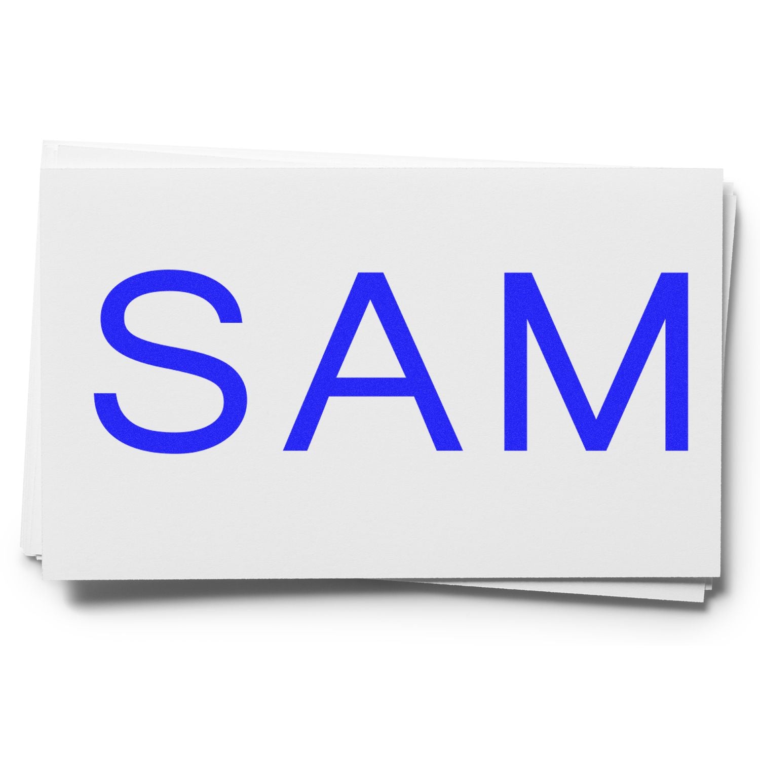 Large Pre-Inked SAM Stamp with bold blue letters "SAM" on a white background.