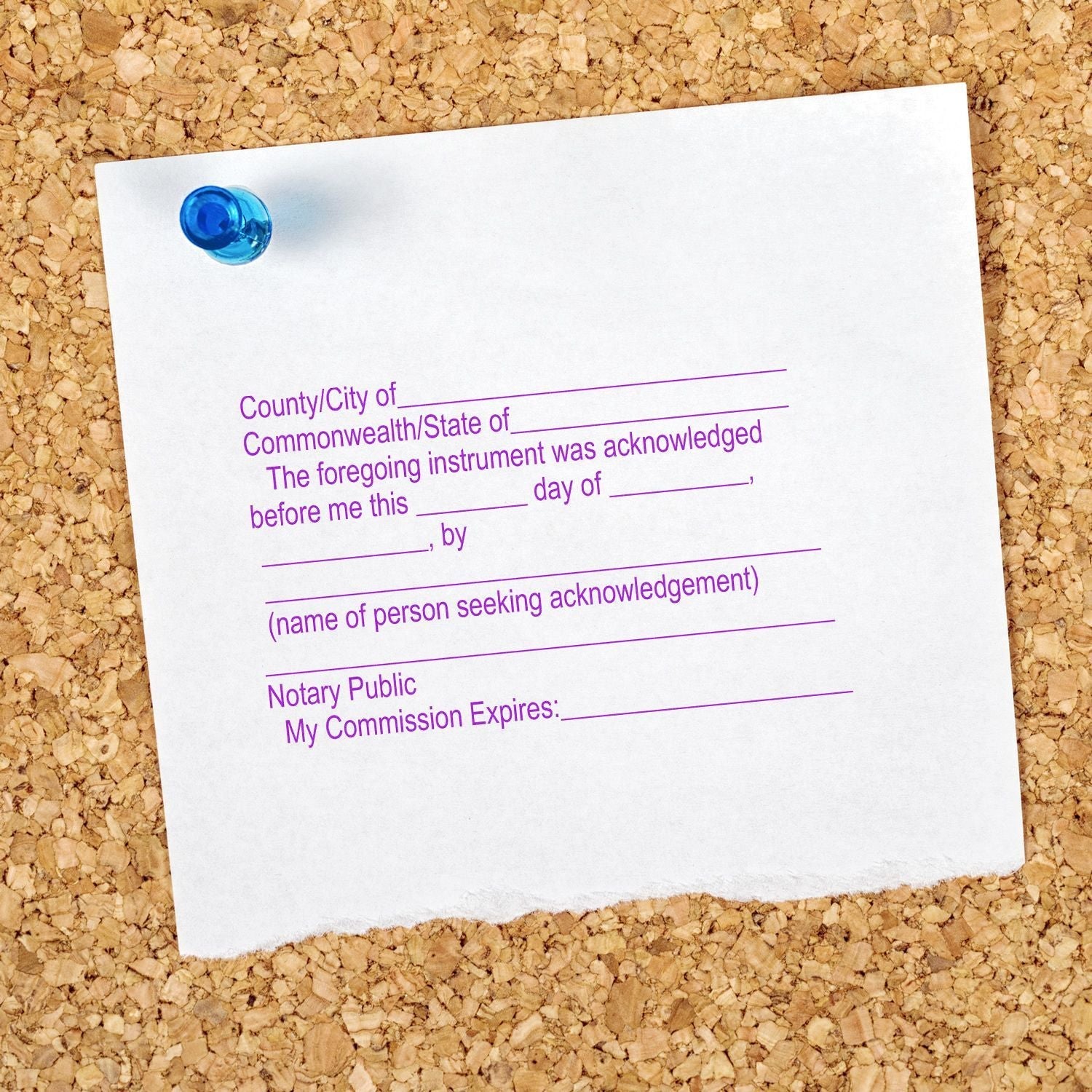 A Notary Acknowledgment Stamp imprint on a white paper pinned to a corkboard, with fields for location, date, name, and notary public details.