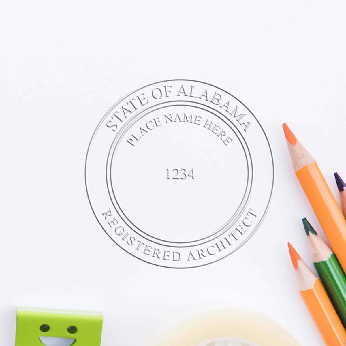 A lifestyle photo showing a stamped image of the Handheld Alabama Architect Seal Embosser on a piece of paper
