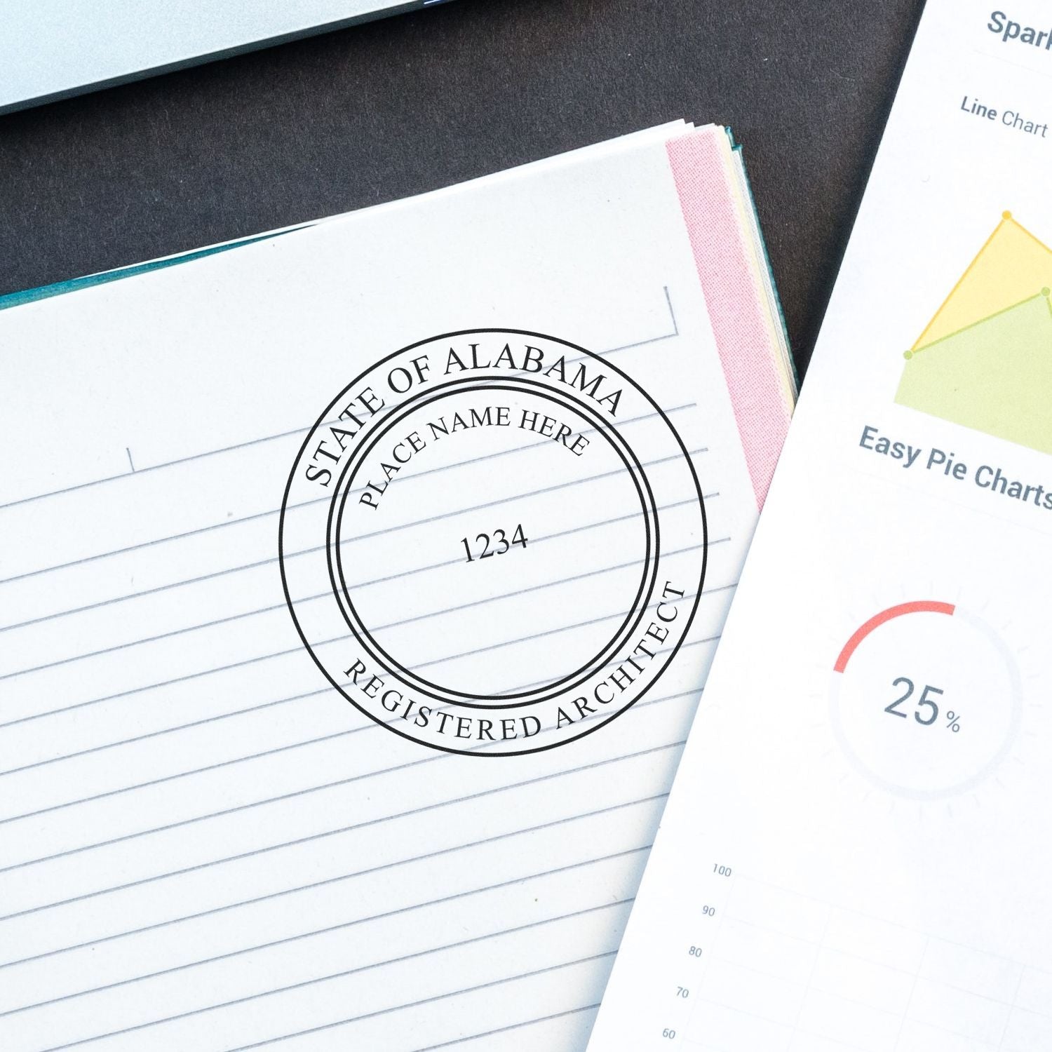 Self Inking Alabama Architect Stamp imprint on a lined notebook page, next to a chart and documents.