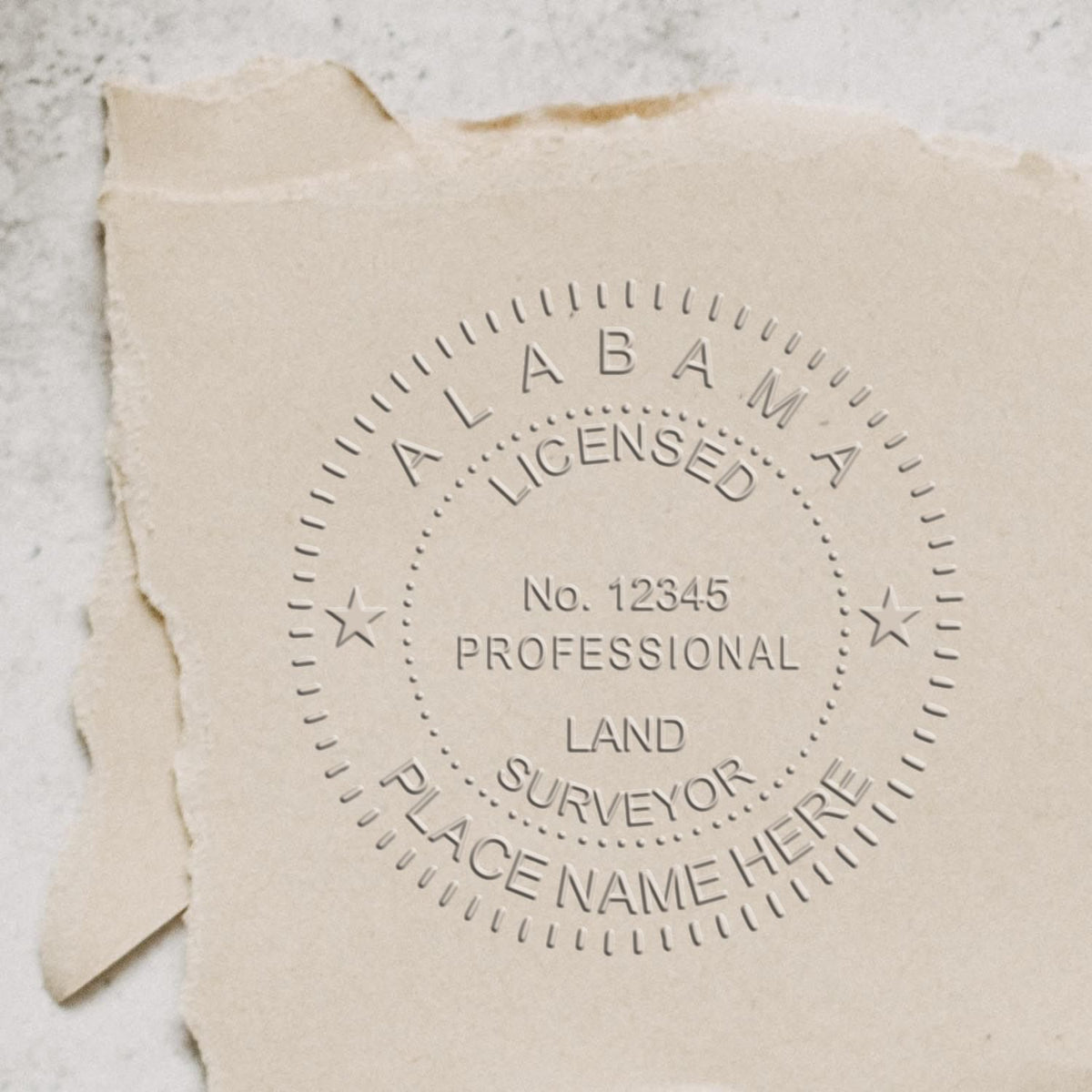 A photograph of the State of Alabama Soft Land Surveyor Embossing Seal stamp impression reveals a vivid, professional image of the on paper.