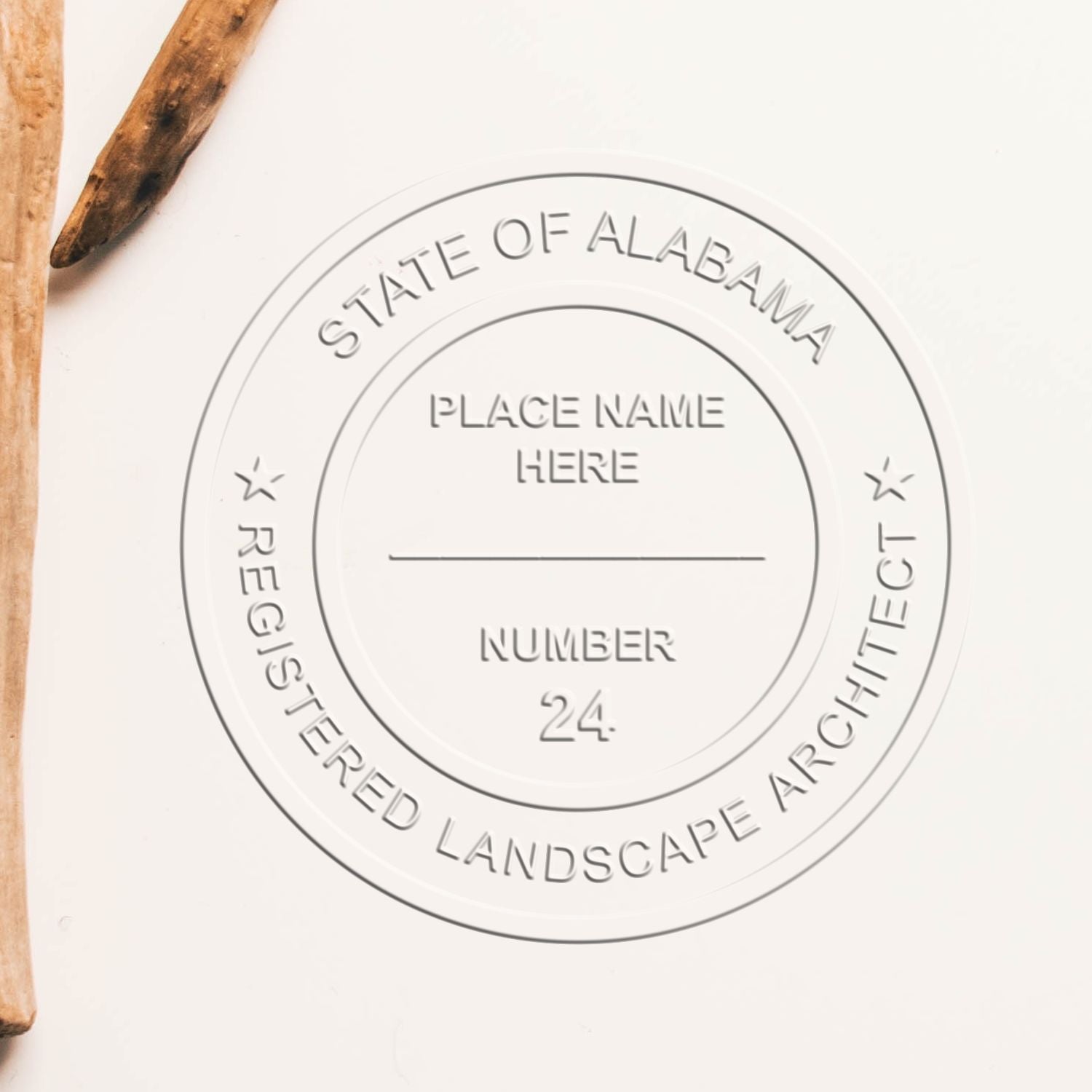 A stamped impression of the State of Alabama Handheld Landscape Architect Seal in this stylish lifestyle photo, setting the tone for a unique and personalized product.