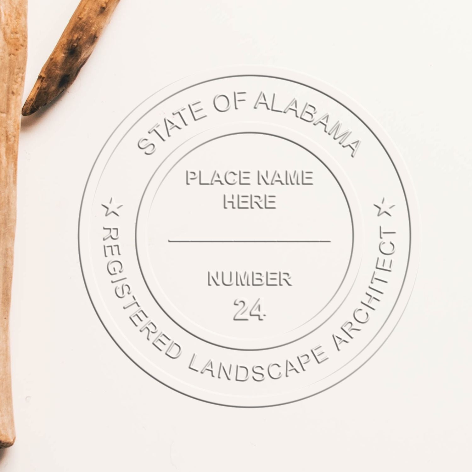 A stamped impression of the State of Alabama Extended Long Reach Landscape Architect Seal Embosser in this stylish lifestyle photo, setting the tone for a unique and personalized product.