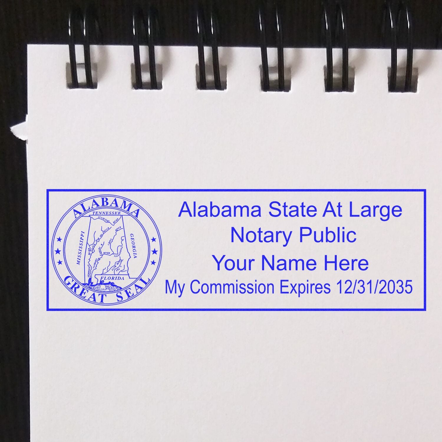 The main image for the Slim Pre-Inked State Seal Notary Stamp for Alabama depicting a sample of the imprint and electronic files
