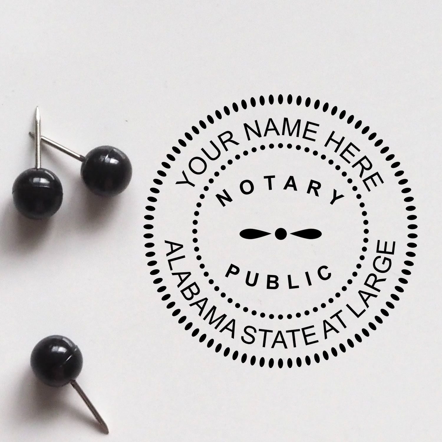 An alternative view of the Premium Pre-Inked Alabama MaxLight Notary Public Stamp stamped on a sheet of paper showing the image in use