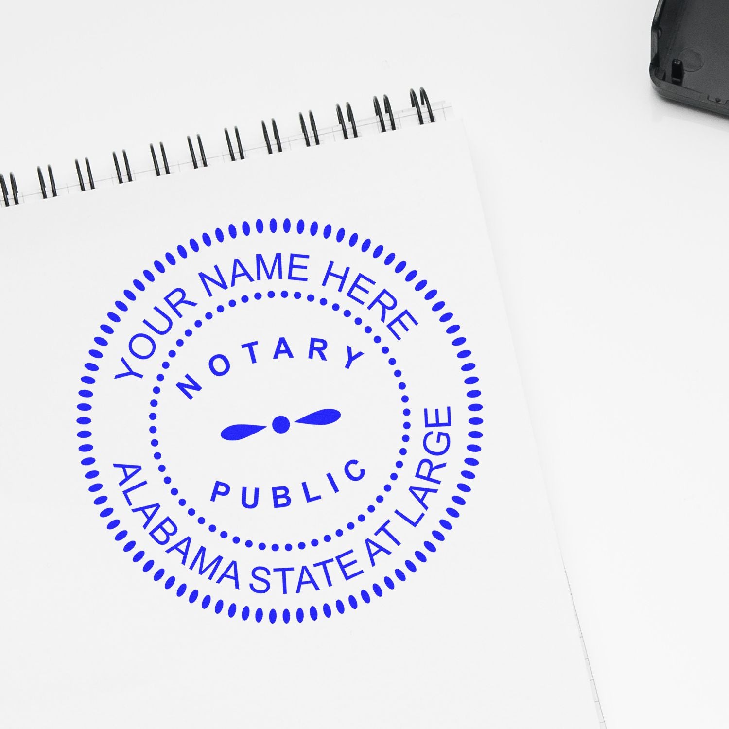The Premium Pre-Inked Alabama MaxLight Notary Public Stamp stamp impression comes to life with a crisp, detailed photo on paper - showcasing true professional quality.