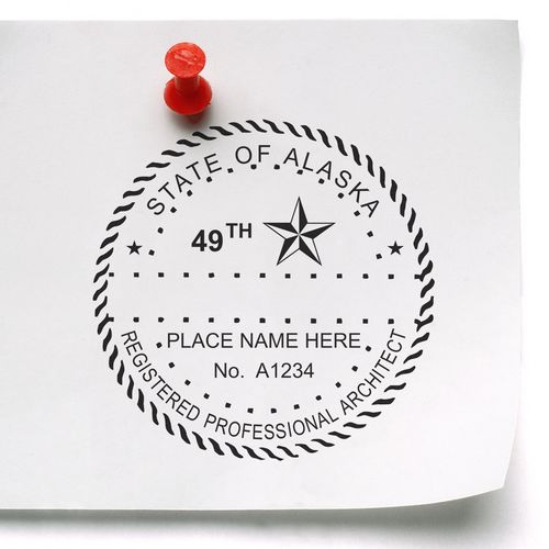 A lifestyle photo showing a stamped image of the Slim Pre-Inked Alaska Architect Seal Stamp on a piece of paper