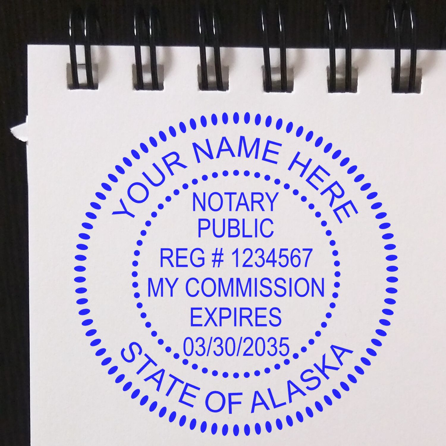 Another Example of a stamped impression of the Official Self-Inking Alaska Notary Stamp on a piece of office paper.
