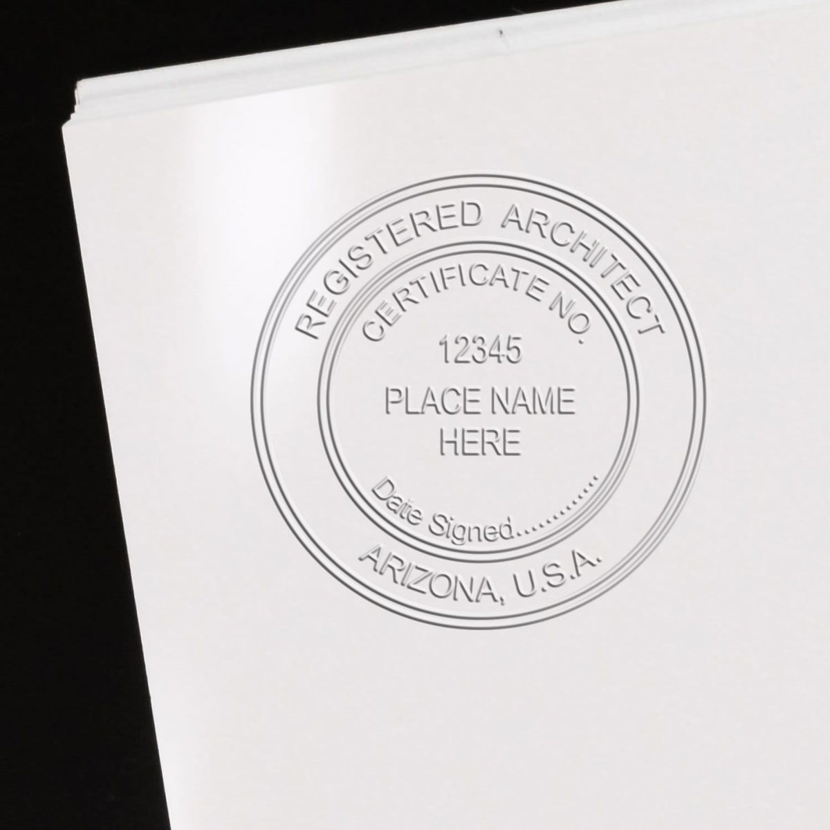 This paper is stamped with a sample imprint of the Extended Long Reach Arizona Architect Seal Embosser, signifying its quality and reliability.