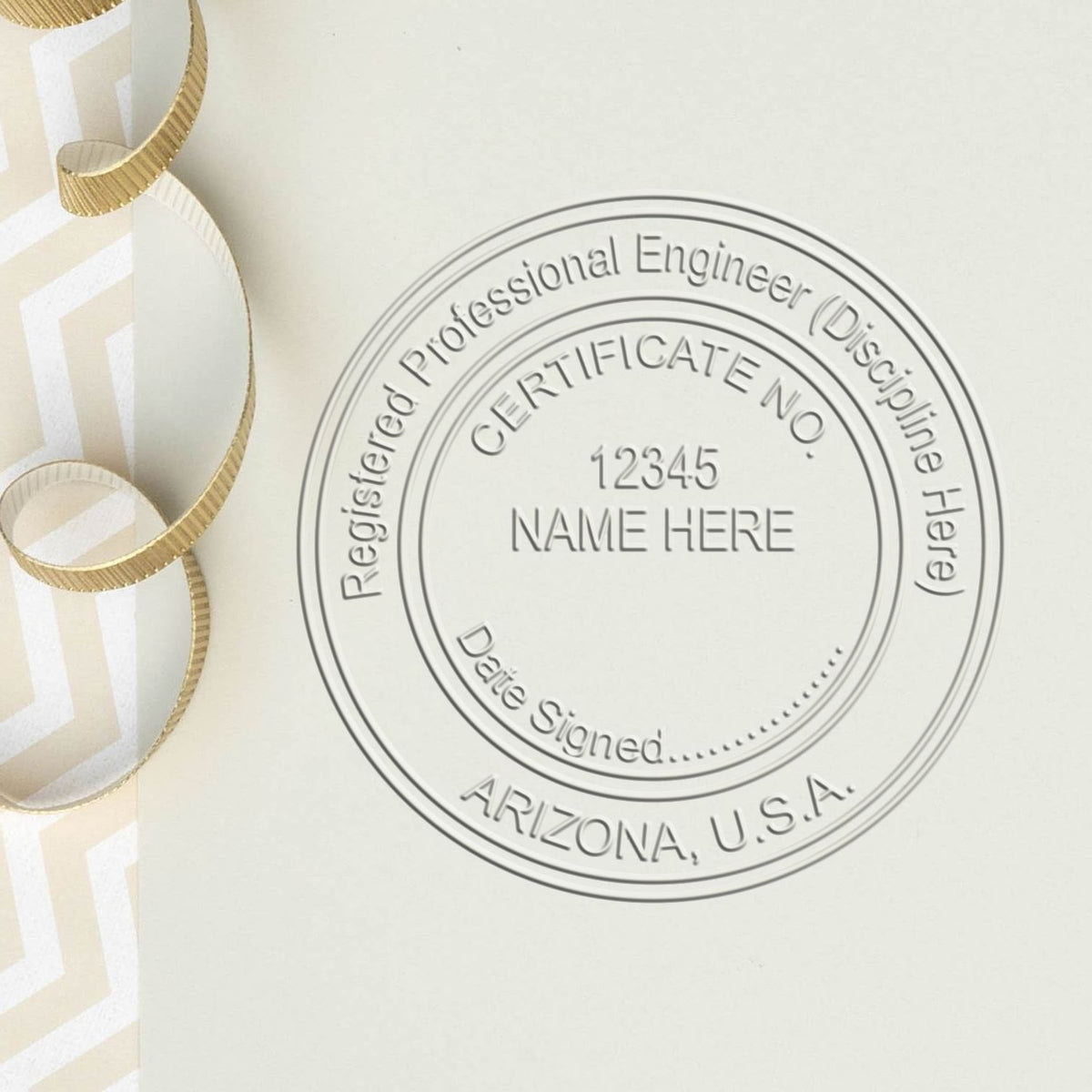 An in use photo of the Hybrid Arizona Engineer Seal showing a sample imprint on a cardstock