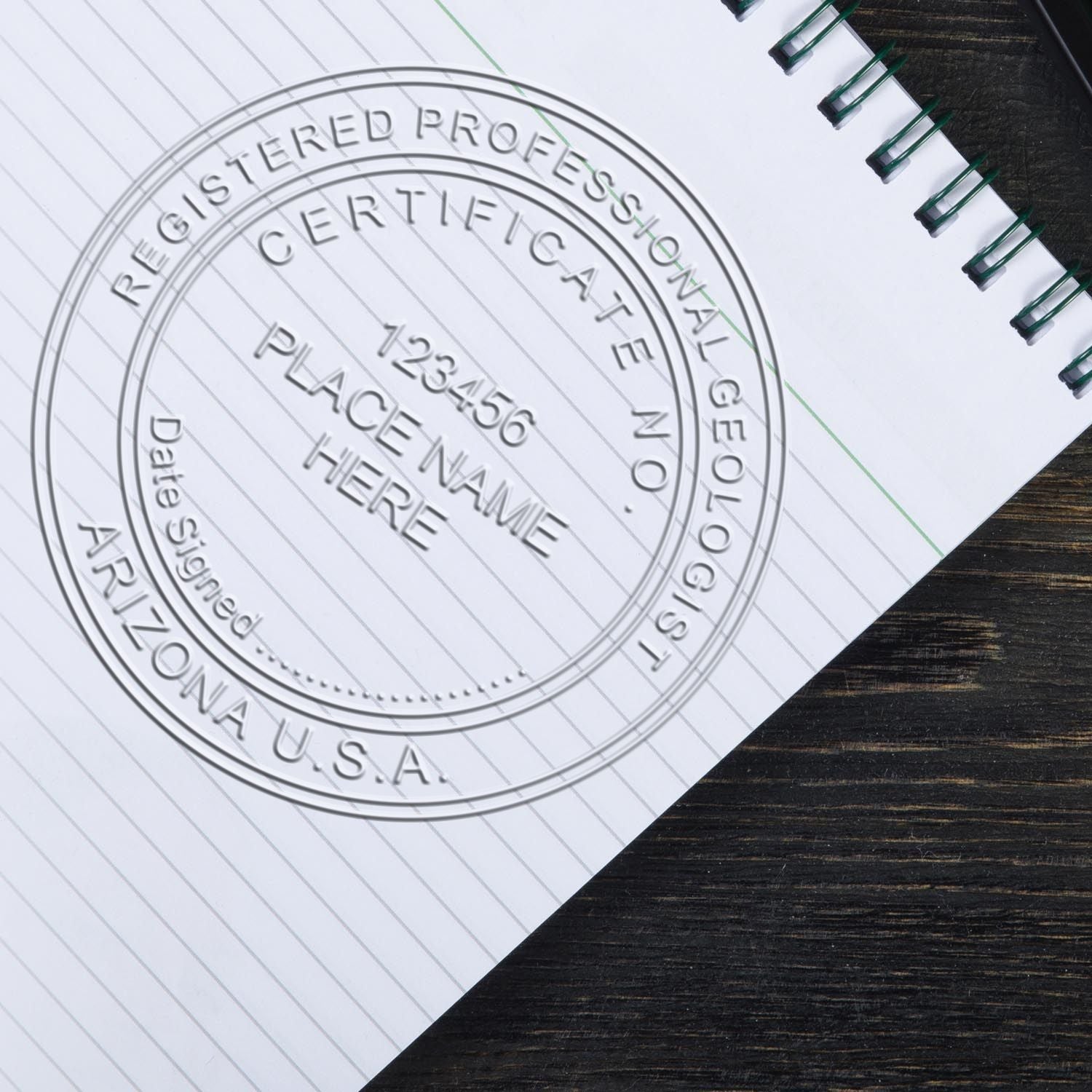 An in use photo of the Gift Arizona Geologist Seal showing a sample imprint on a cardstock