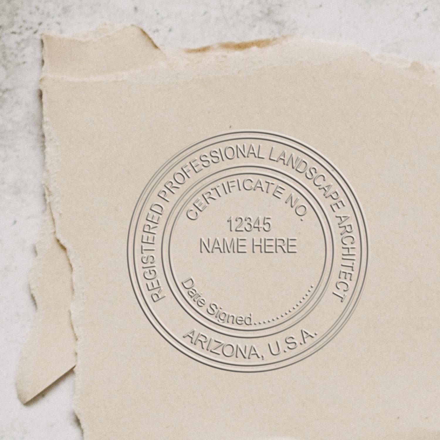 An alternative view of the Heavy Duty Arizona Landscape Architect Cast Iron Embosser stamped on a sheet of paper showing the image in use