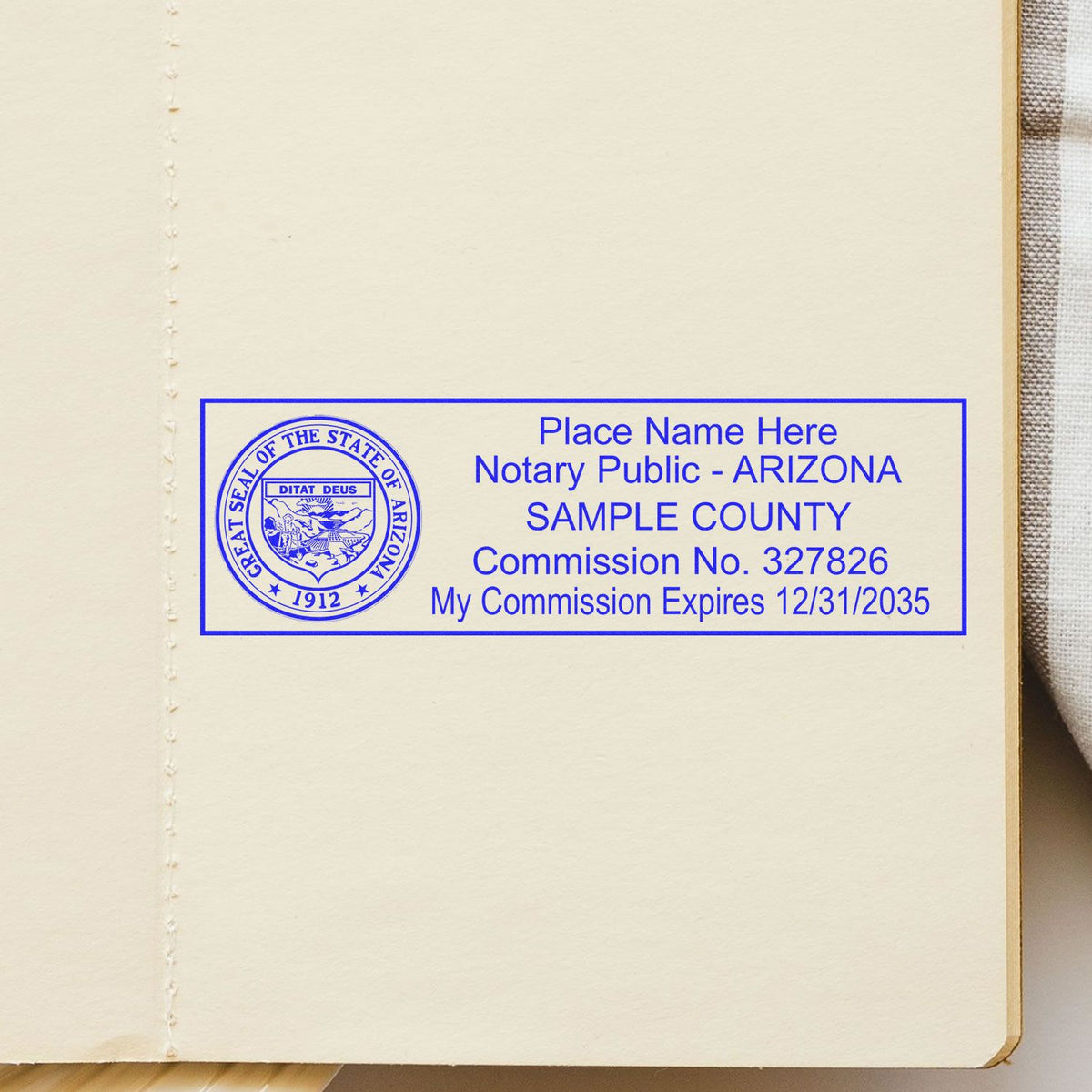 A lifestyle photo showing a stamped image of the Wooden Handle Arizona State Seal Notary Public Stamp on a piece of paper
