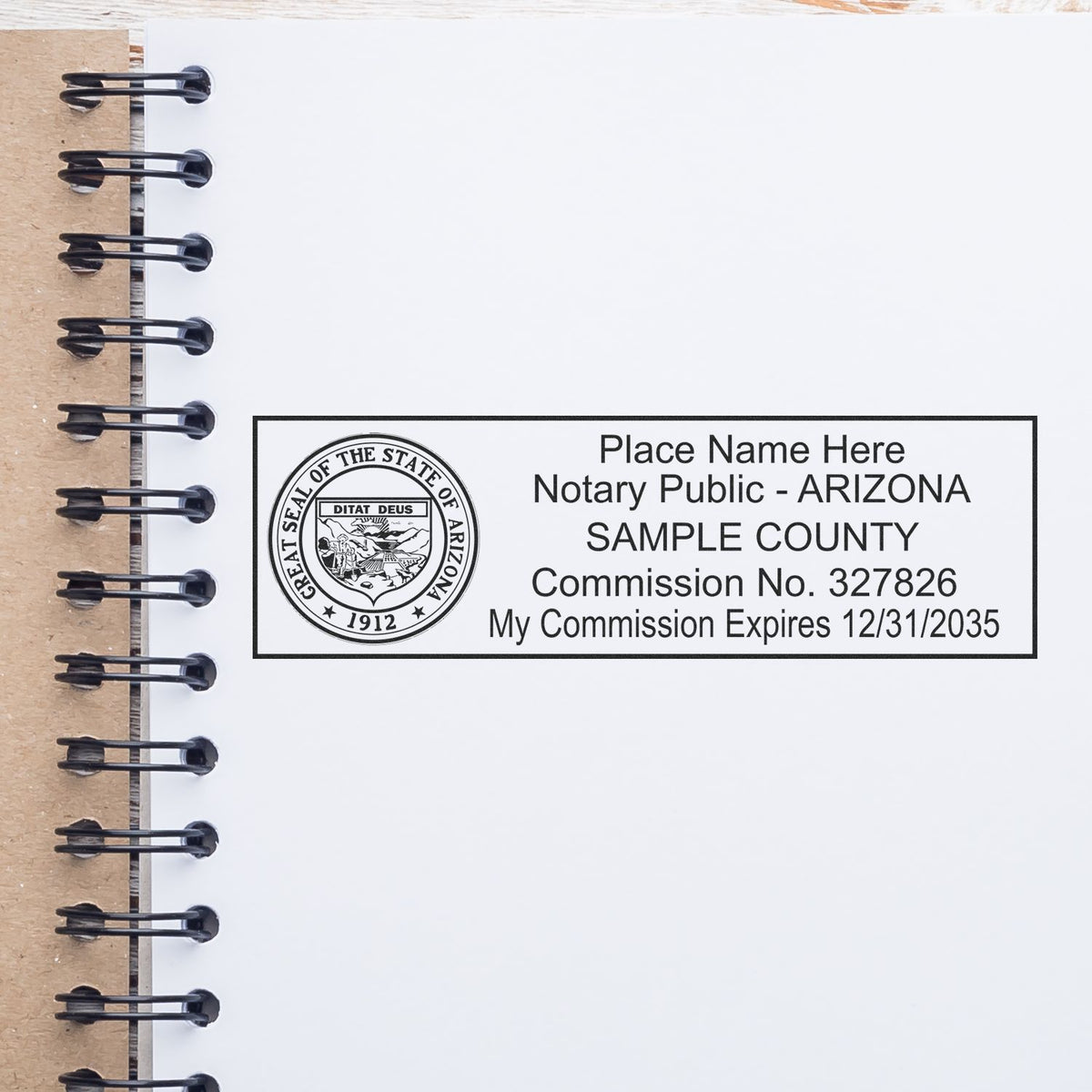 A lifestyle photo showing a stamped image of the Heavy-Duty Arizona Rectangular Notary Stamp on a piece of paper