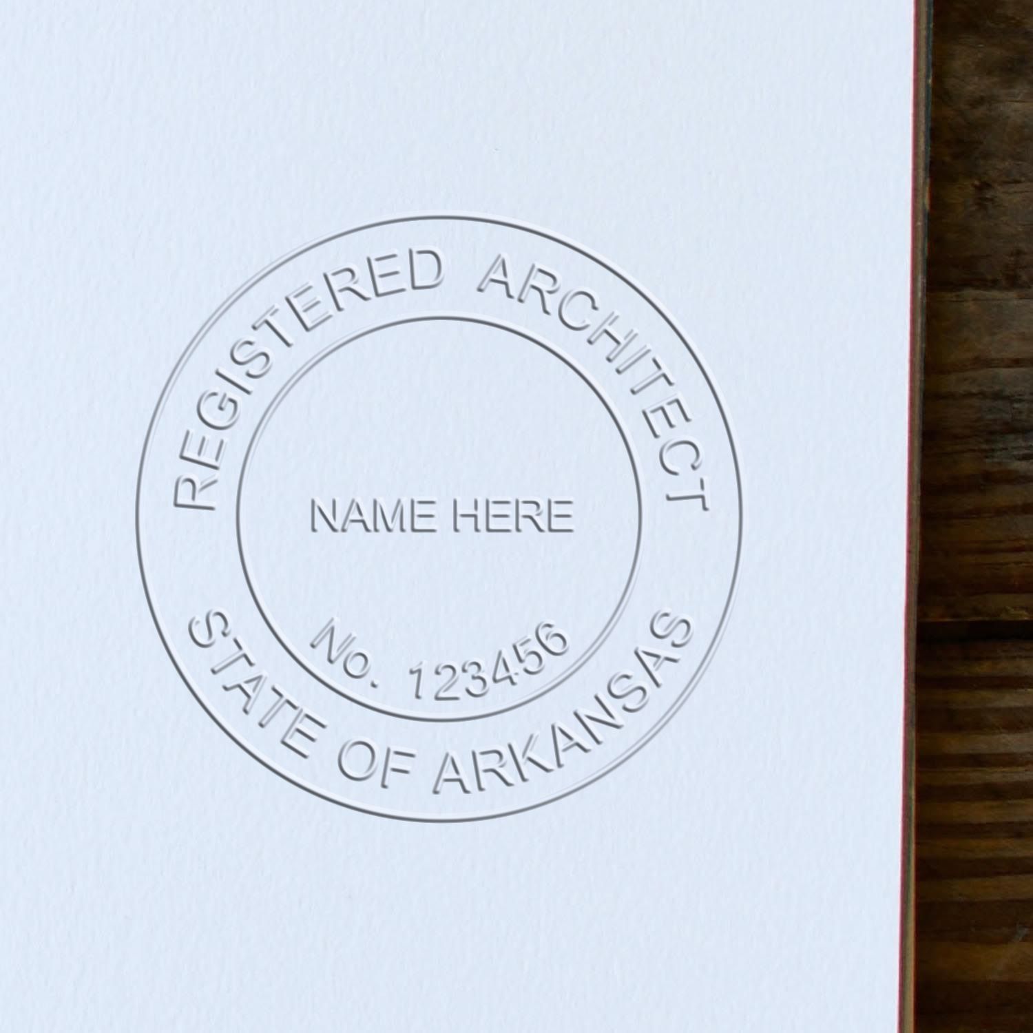 A photograph of the Hybrid Arkansas Architect Seal stamp impression reveals a vivid, professional image of the on paper.