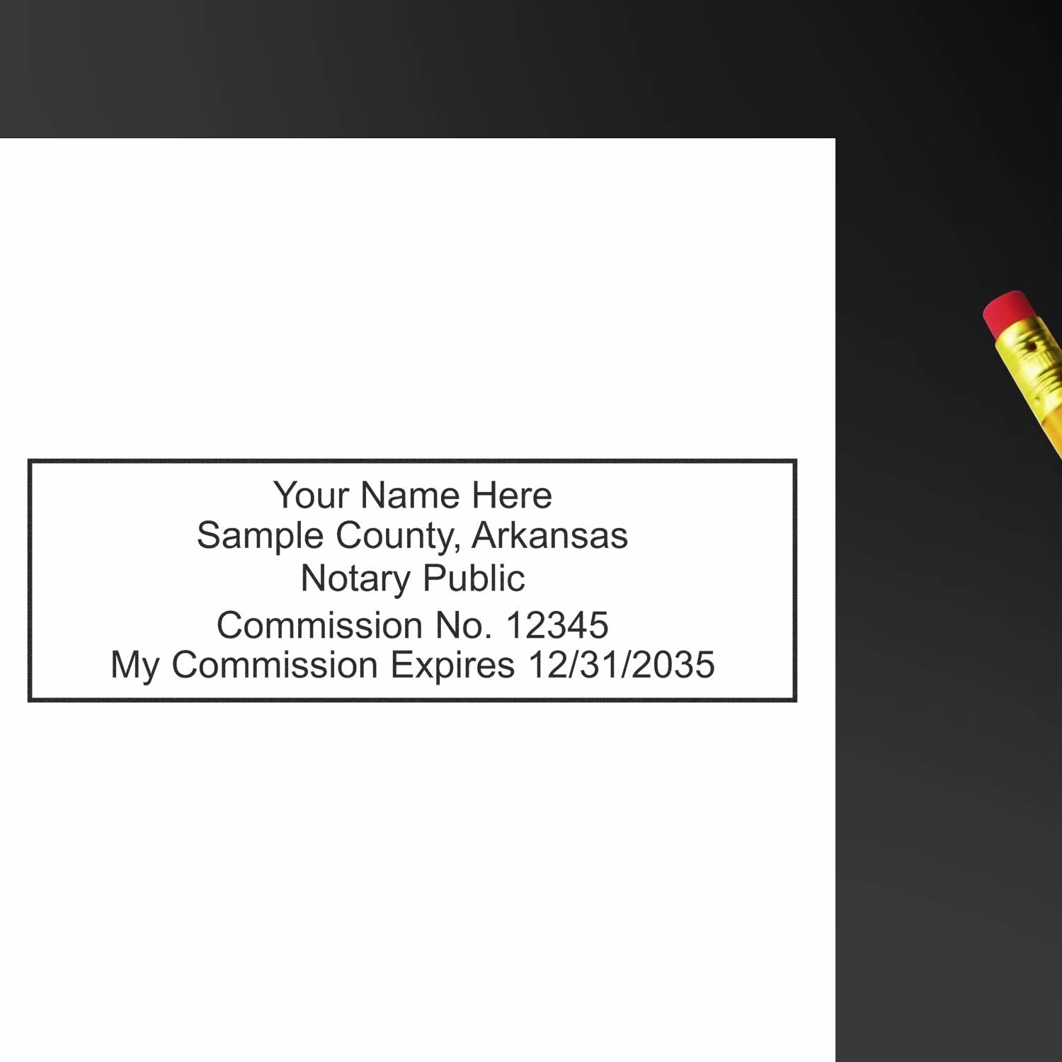 Image of a Wood Handle Arkansas Rectangular Notary Public Stamp imprint with sample text including name, county, commission number, and expiration date.