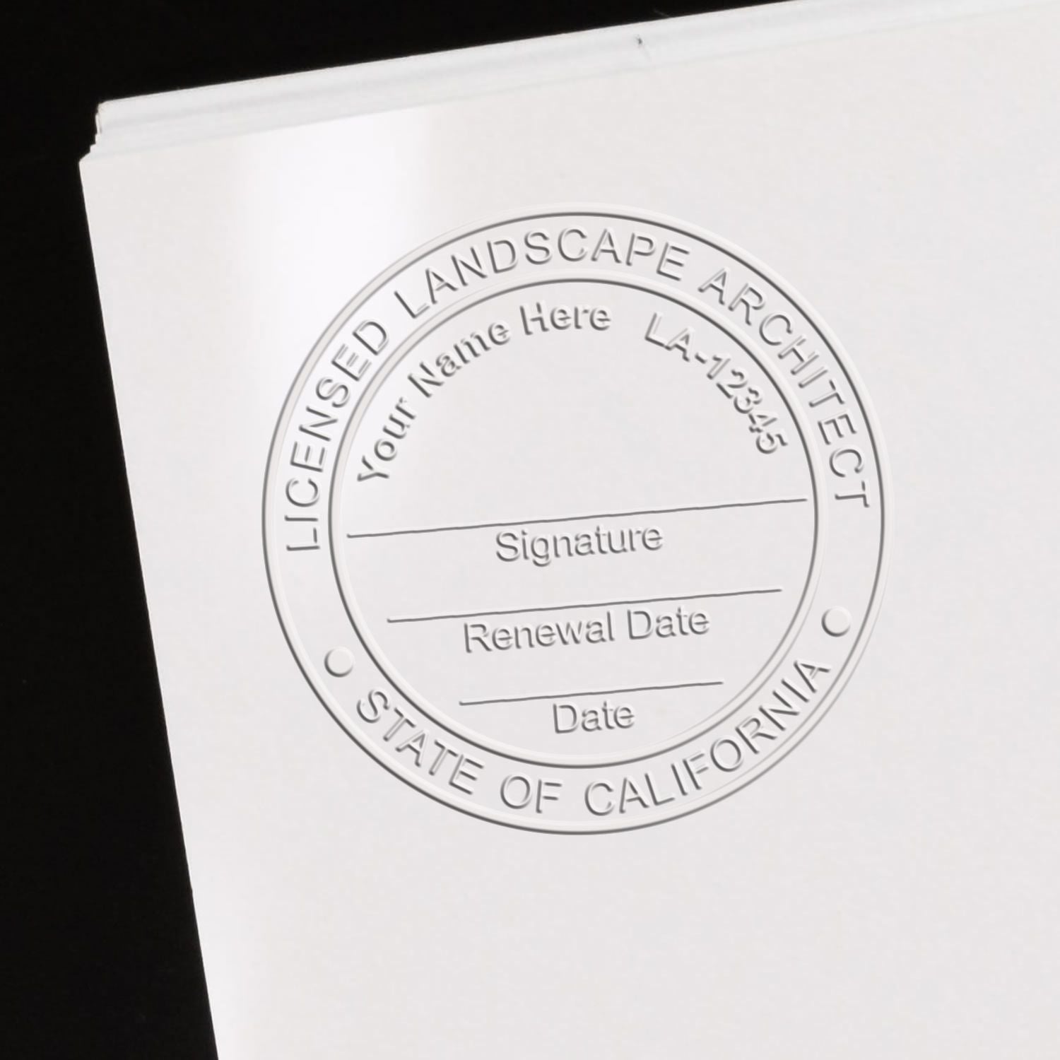 An in use photo of the Hybrid California Landscape Architect Seal showing a sample imprint on a cardstock