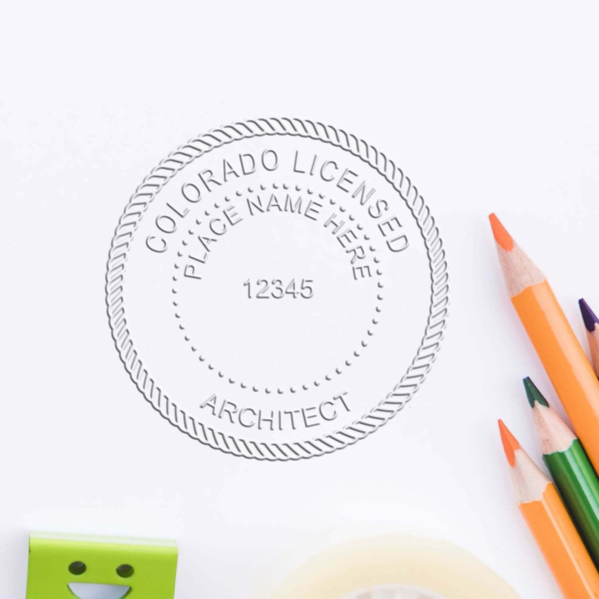 A stamped impression of the State of Colorado Architectural Seal Embosser in this stylish lifestyle photo, setting the tone for a unique and personalized product.