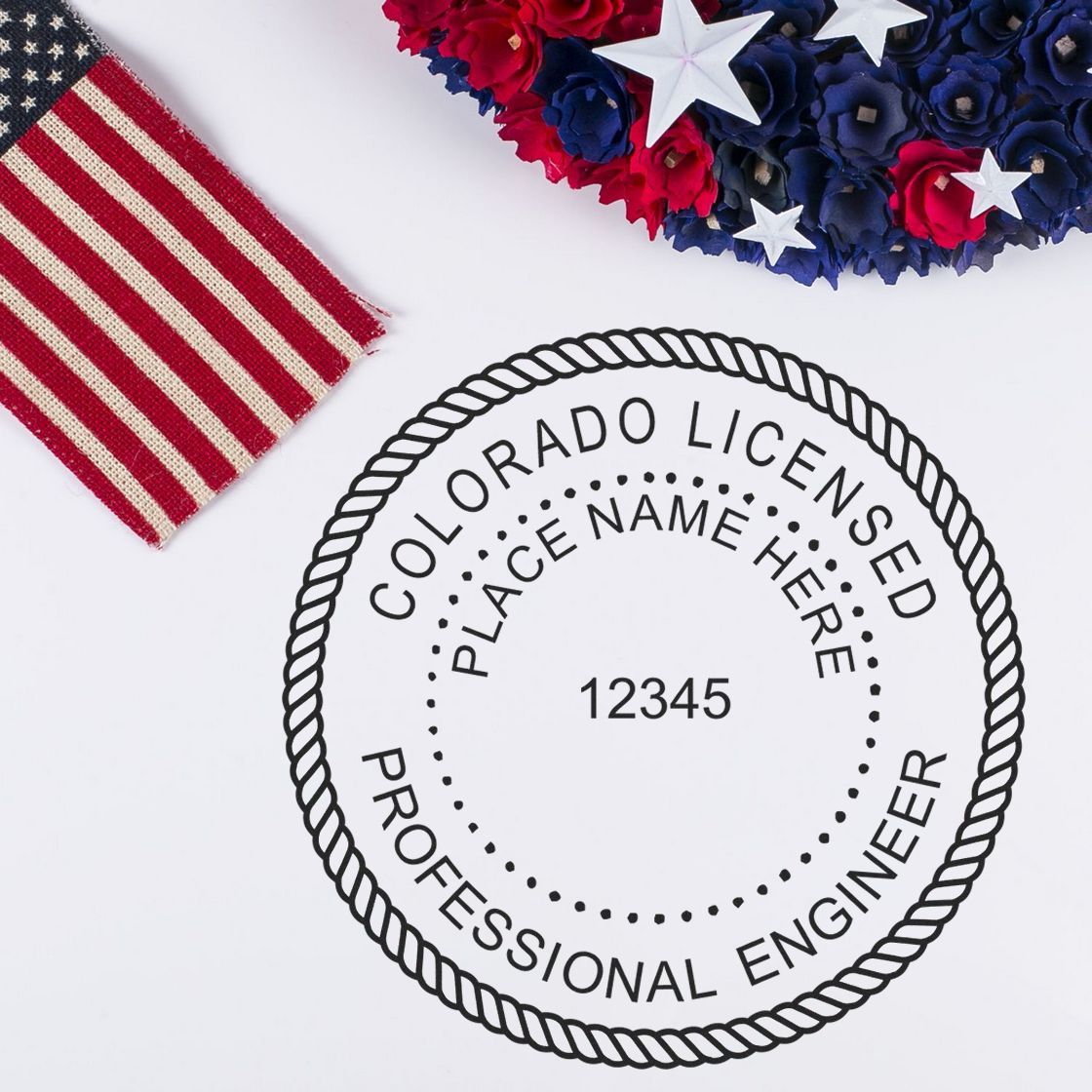 A lifestyle photo showing a stamped image of the Digital Colorado PE Stamp and Electronic Seal for Colorado Engineer on a piece of paper