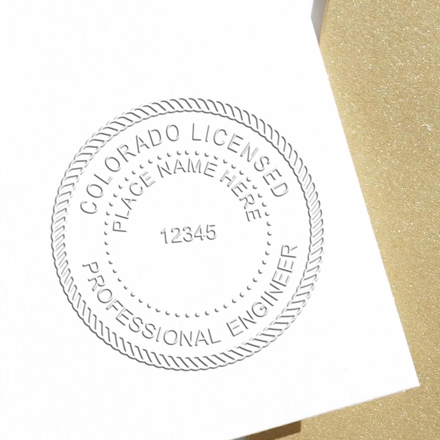 An alternative view of the State of Colorado Extended Long Reach Engineer Seal stamped on a sheet of paper showing the image in use