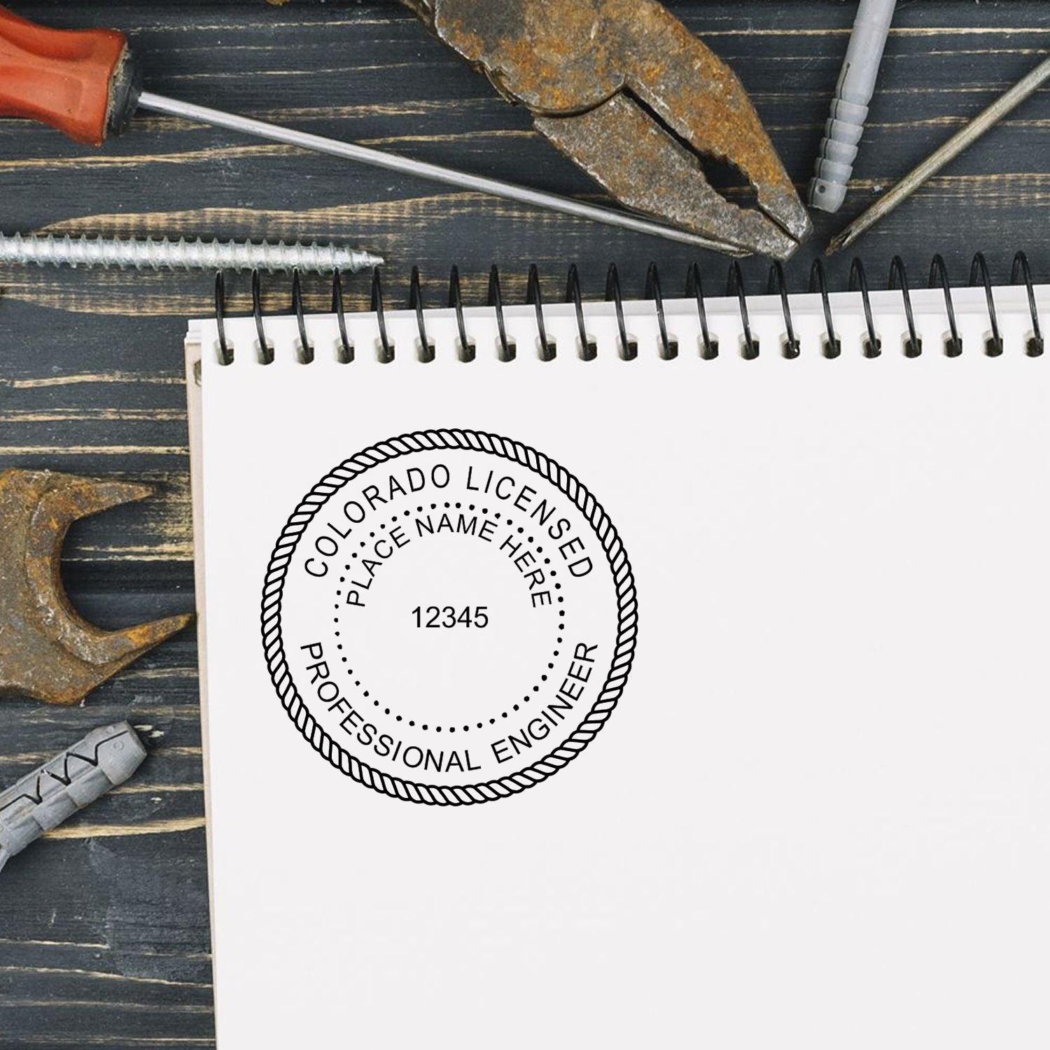 Another Example of a stamped impression of the Premium MaxLight Pre-Inked Colorado Engineering Stamp on a piece of office paper.