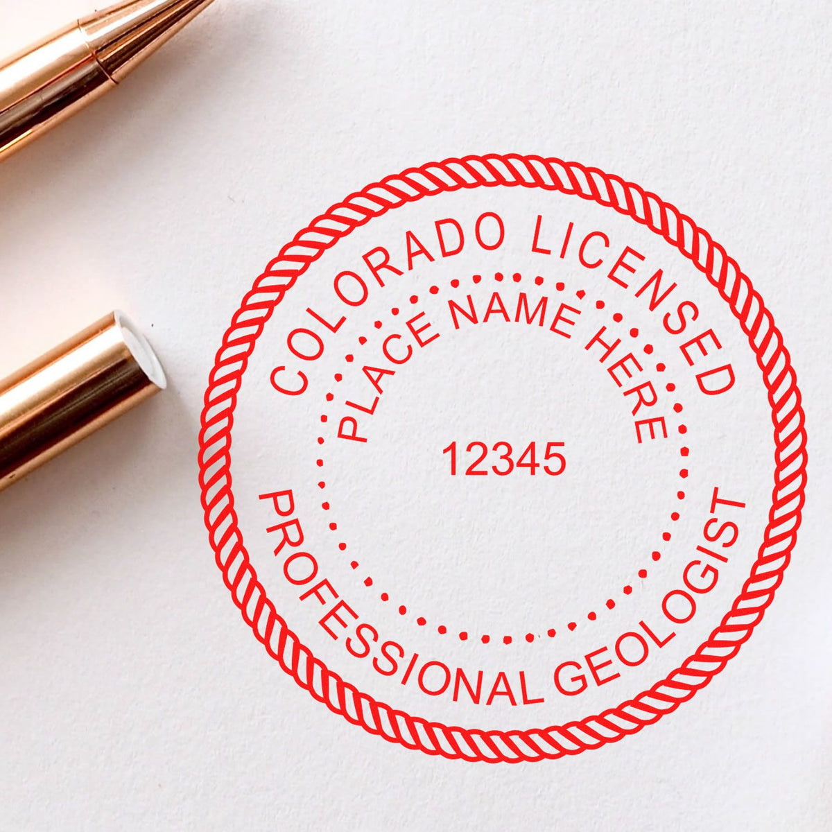An in use photo of the Slim Pre-Inked Colorado Professional Geologist Seal Stamp showing a sample imprint on a cardstock