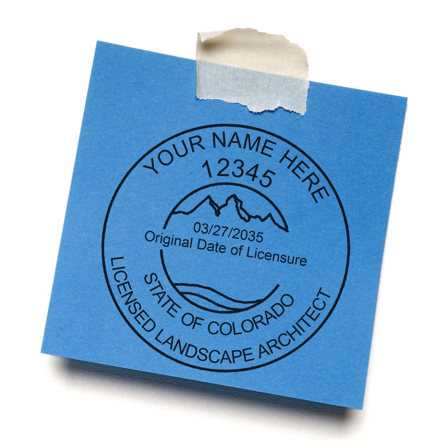 A lifestyle photo showing a stamped image of the Digital Colorado Landscape Architect Stamp on a piece of paper