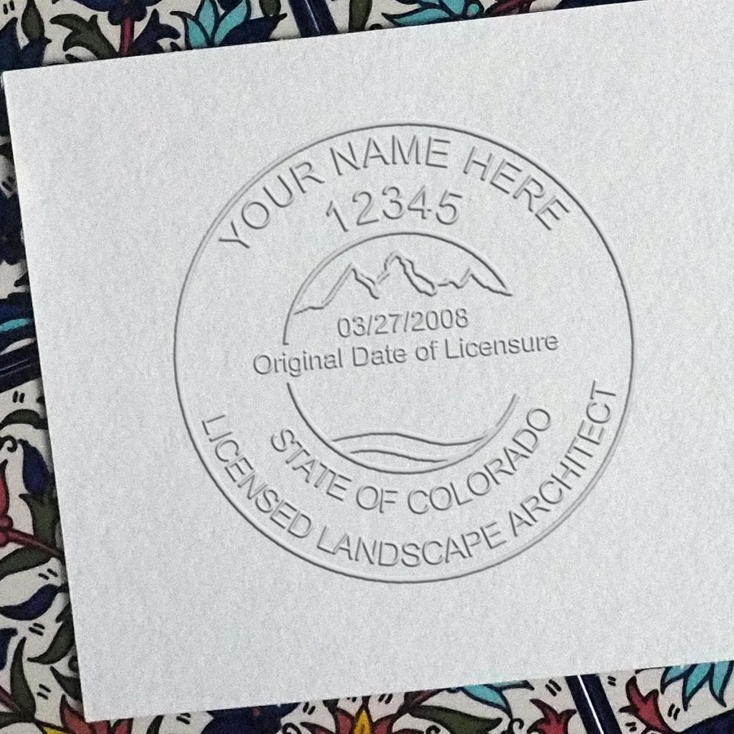 A photograph of the Hybrid Colorado Landscape Architect Seal stamp impression reveals a vivid, professional image of the on paper.