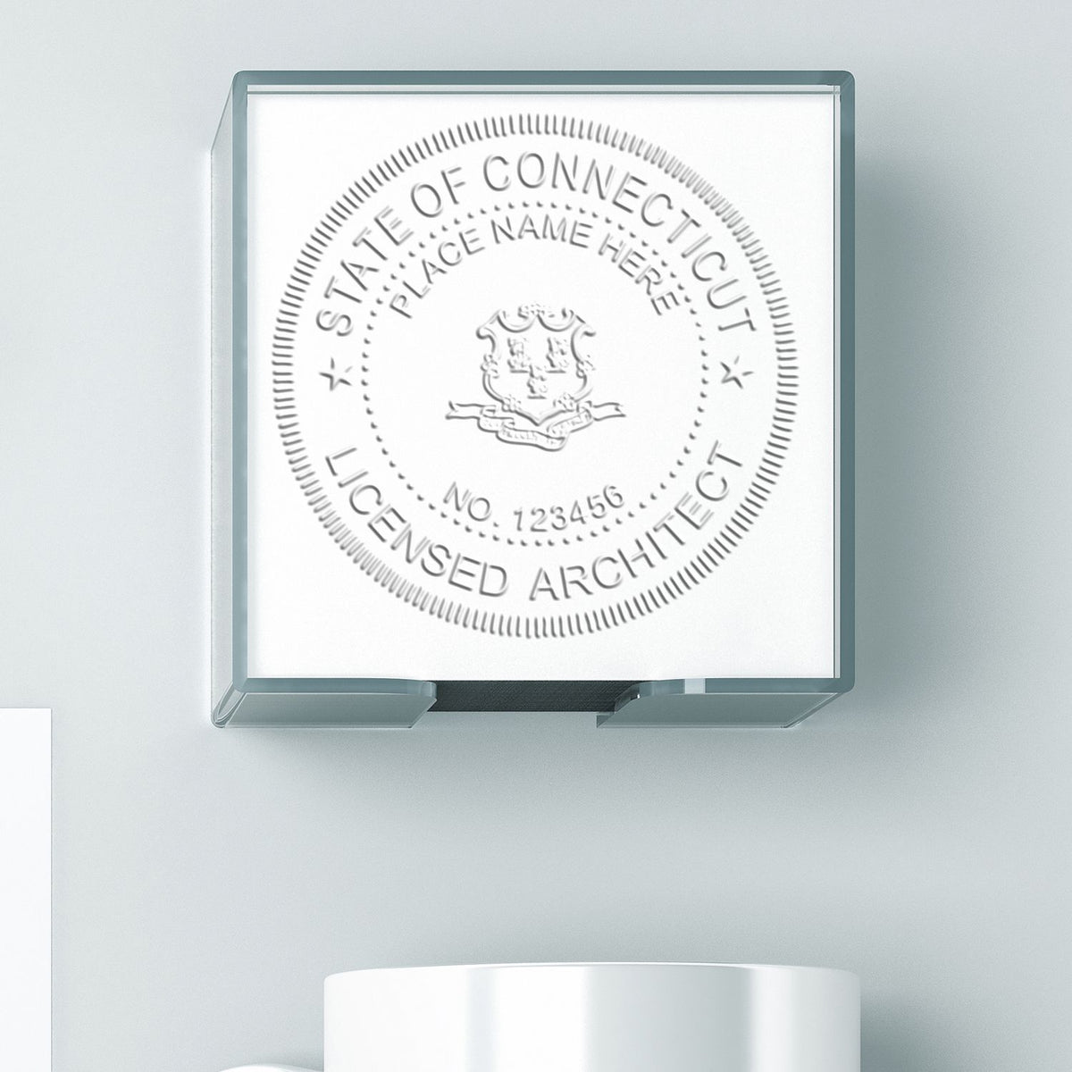 A lifestyle photo showing a stamped image of the Extended Long Reach Connecticut Architect Seal Embosser on a piece of paper