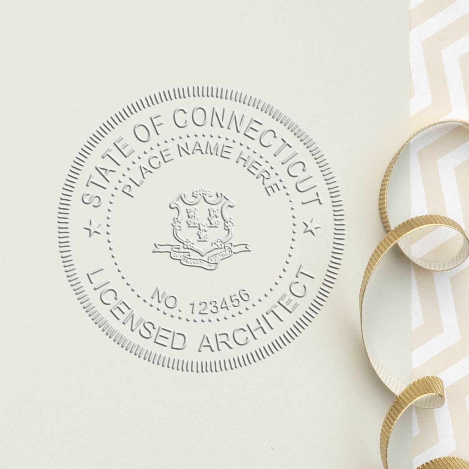 A stamped impression of the State of Connecticut Architectural Seal Embosser in this stylish lifestyle photo, setting the tone for a unique and personalized product.