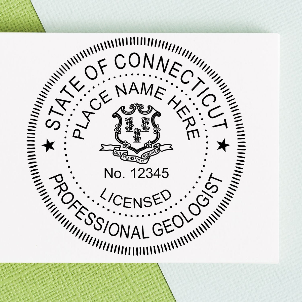 A lifestyle photo showing a stamped image of the Slim Pre-Inked Connecticut Professional Geologist Seal Stamp on a piece of paper