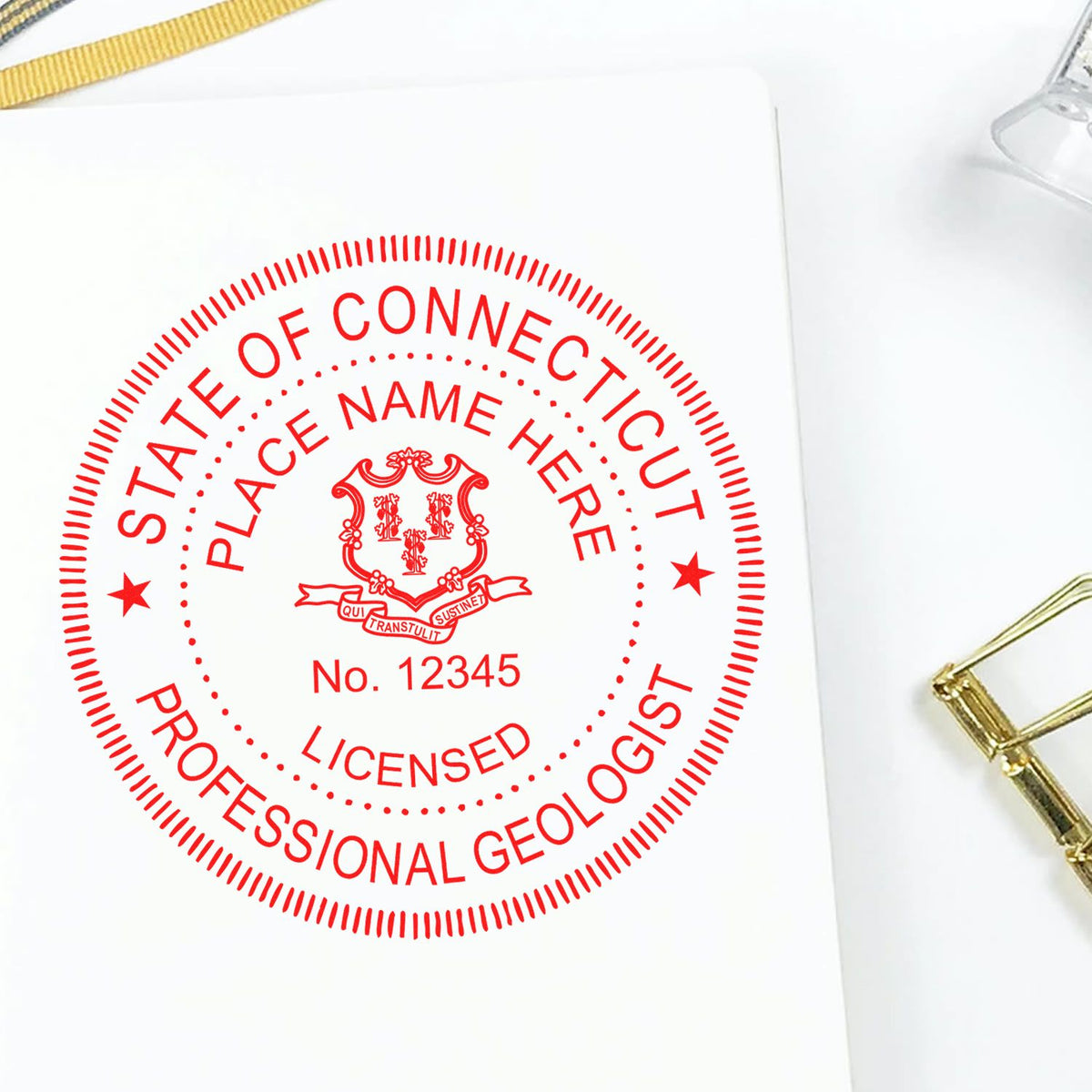 An in use photo of the Slim Pre-Inked Connecticut Professional Geologist Seal Stamp showing a sample imprint on a cardstock