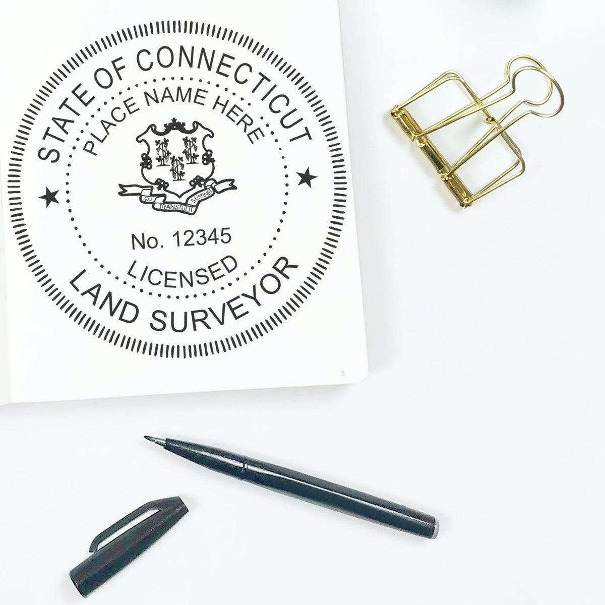 A lifestyle photo showing a stamped image of the Slim Pre-Inked Connecticut Land Surveyor Seal Stamp on a piece of paper