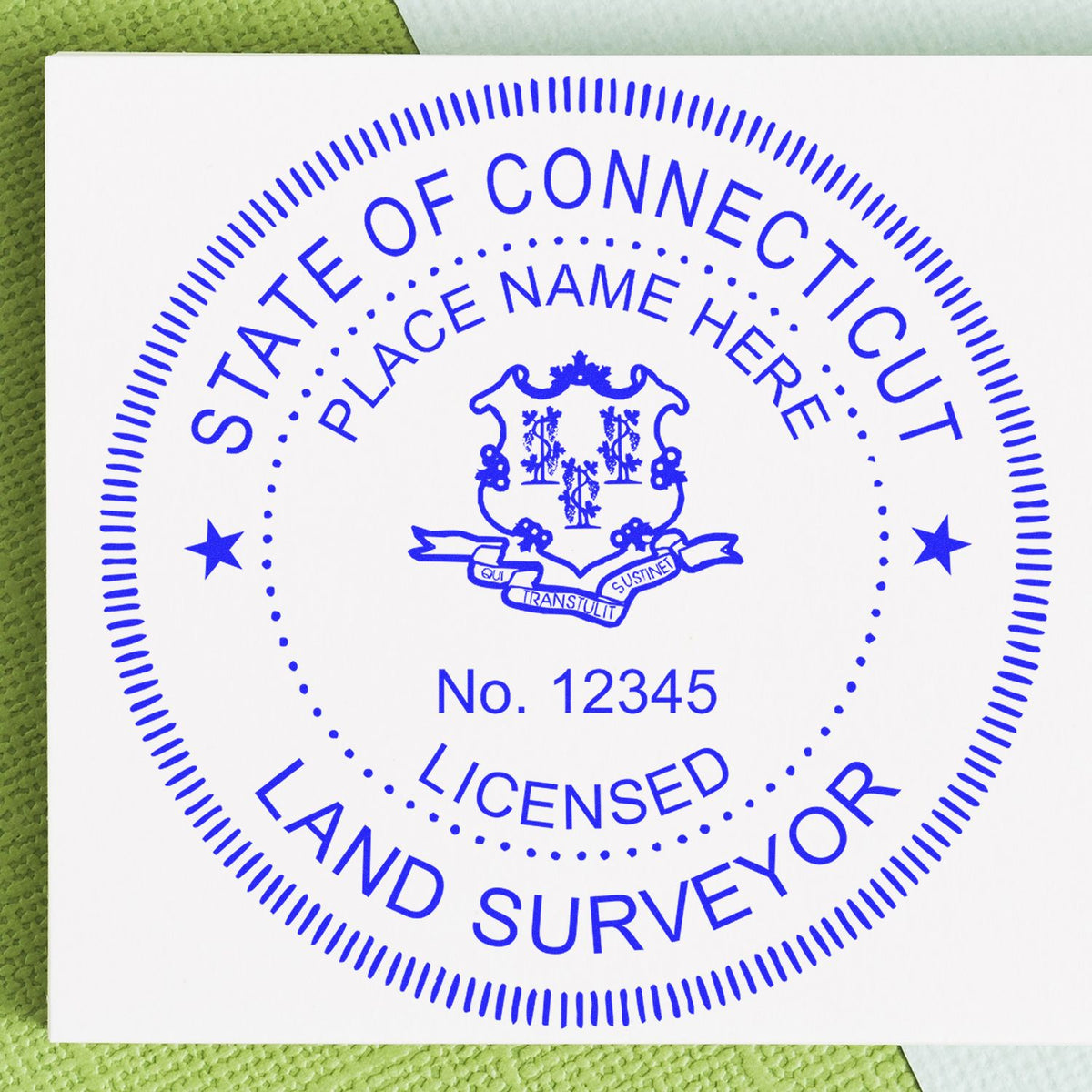 A lifestyle photo showing a stamped image of the Slim Pre-Inked Connecticut Land Surveyor Seal Stamp on a piece of paper
