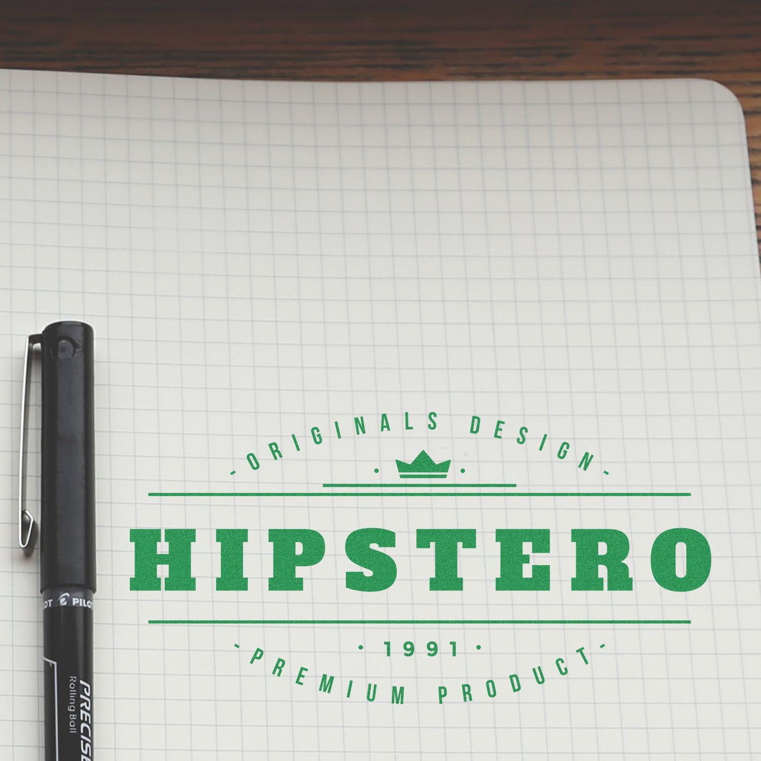 Custom Rubber Stamp Size 3 x 6 used on a notebook with a pen beside it, displaying the text HIPSTERO Originals Design Premium Product 1991 .